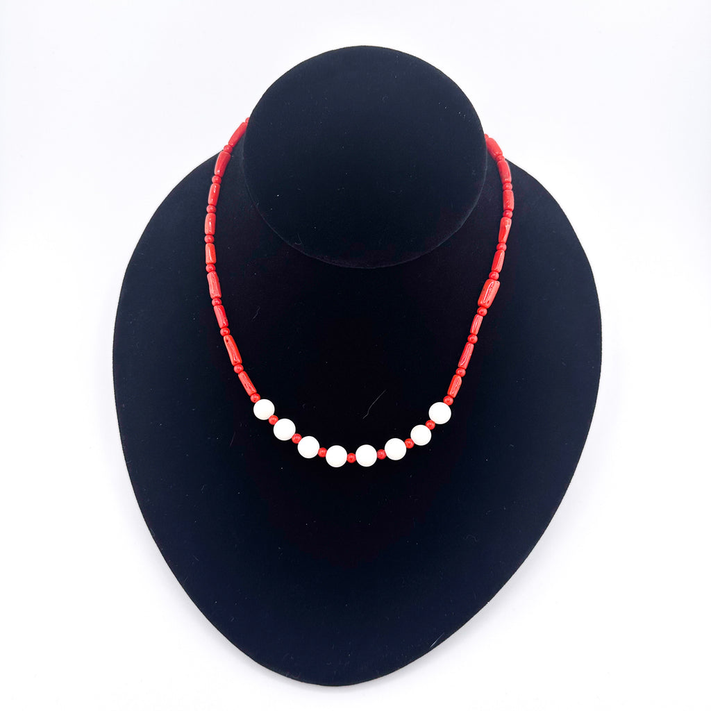Angel Skin Coral, Coral, and Sterling Silver Necklace on black bust