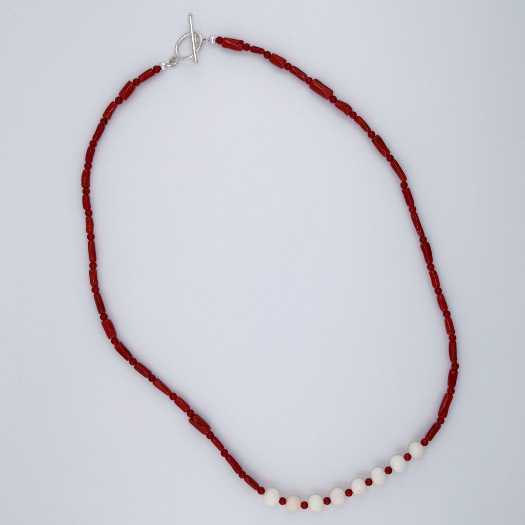 Angel Skin Coral, Coral, and Sterling Silver Necklace flatlay on white background