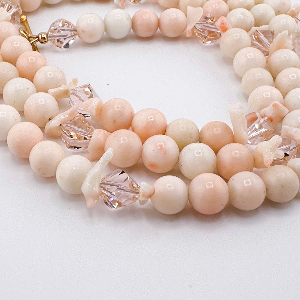 Angel Skin Coral, Swarovski Crystal, and 22K Gold Vermeil Necklace closeup on white background