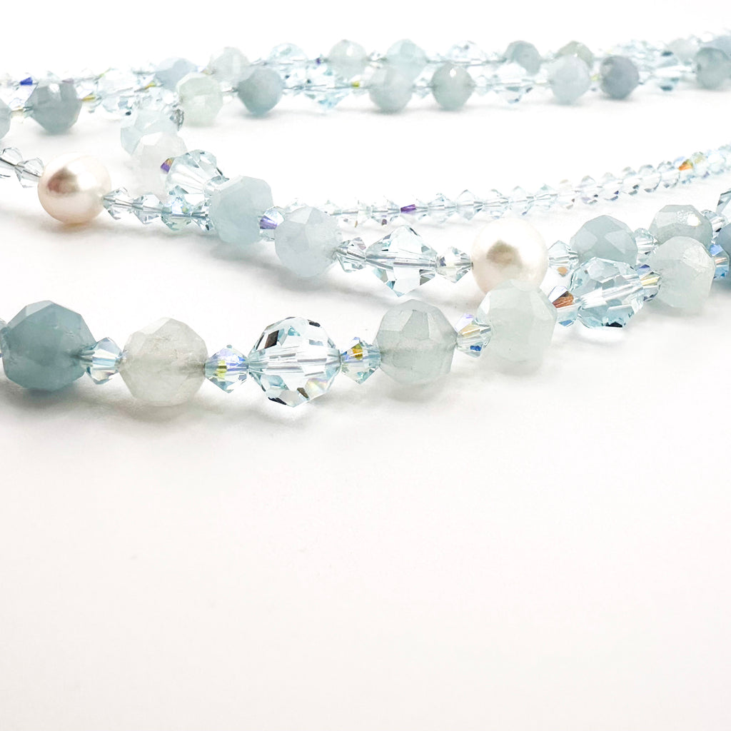 Aquamarine, Swarovski Crystal, and Sterling Silver Necklace close-up on white background