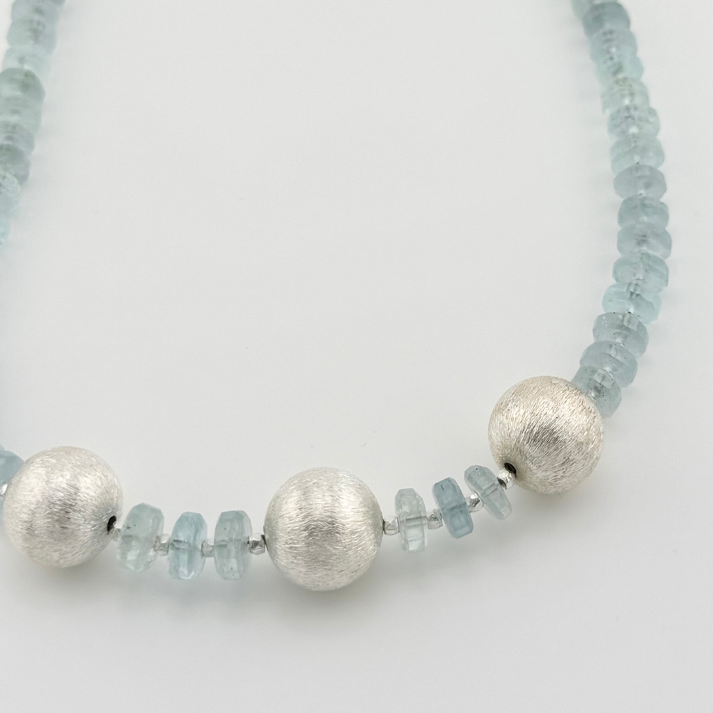 Aquamarine and Sterling Silver Necklace close-up on white background