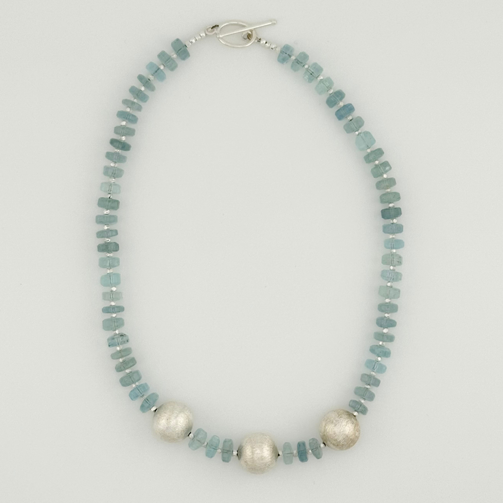 Aquamarine and Sterling Silver Necklace flatlay on white background