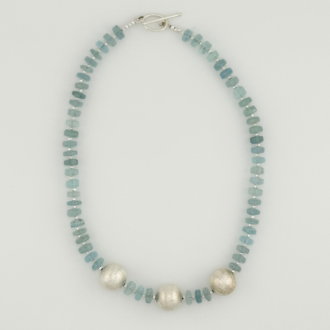 Aquamarine and Sterling Silver Necklace flatlay on white background