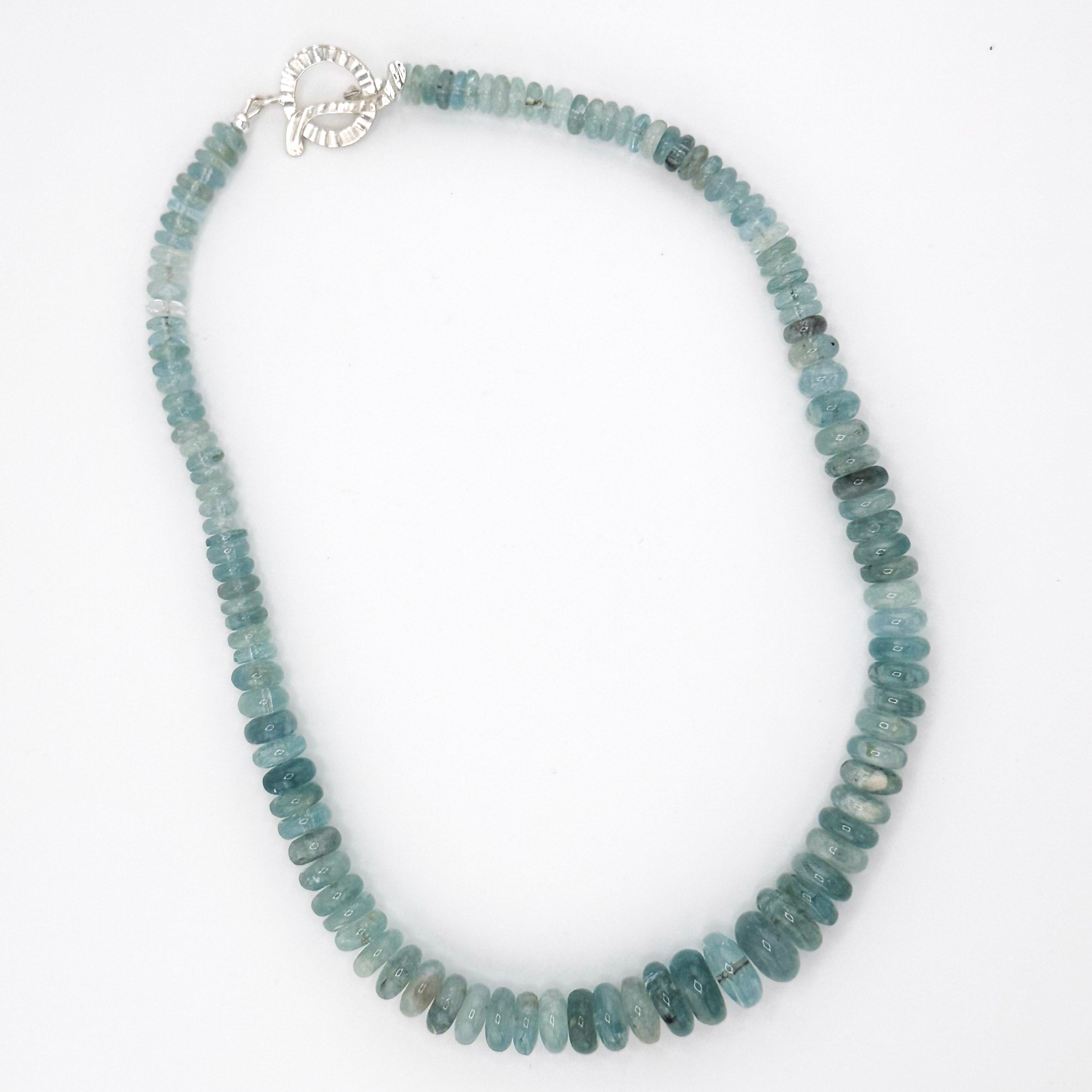 Aquamarine and Sterling Silver Necklace flatlay on white background