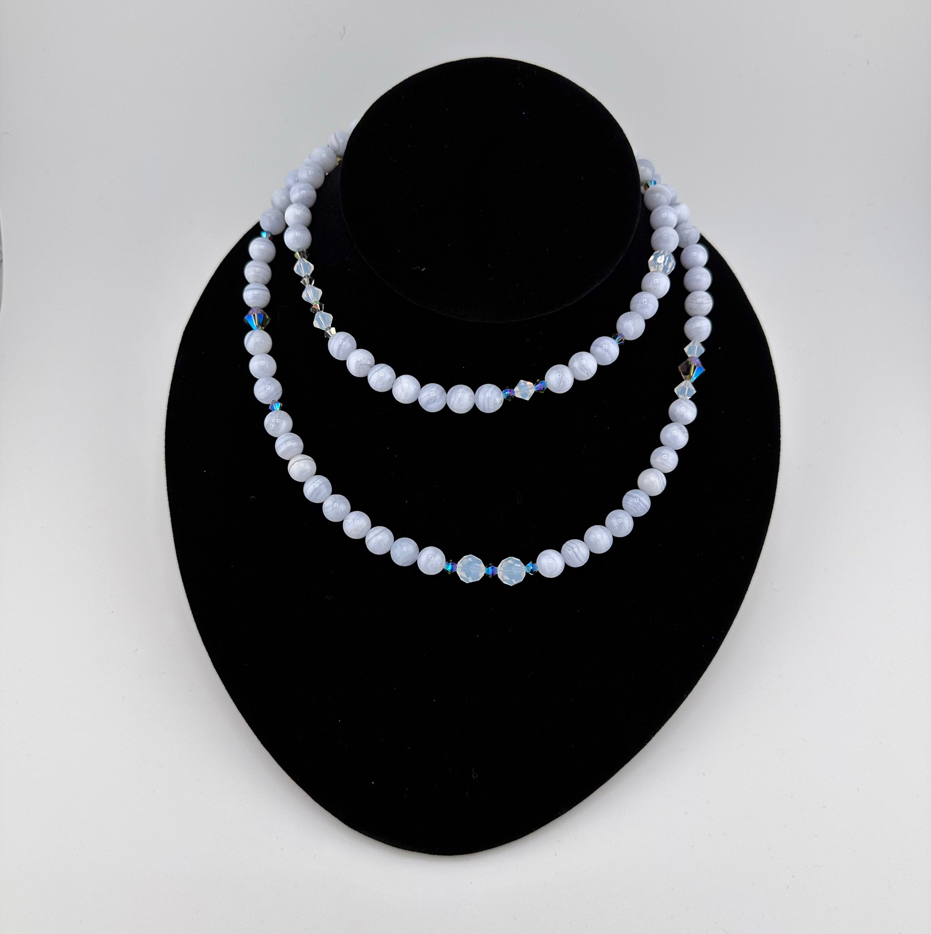 Blue Lace Agate, Swarovski Crystal, and Sterling Silver Necklace on black bust
