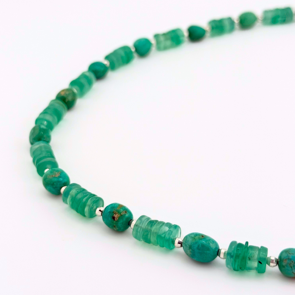Chrysophrase, Turquoise, Hematite, and Sterling Silver beaded necklace closeup on white background