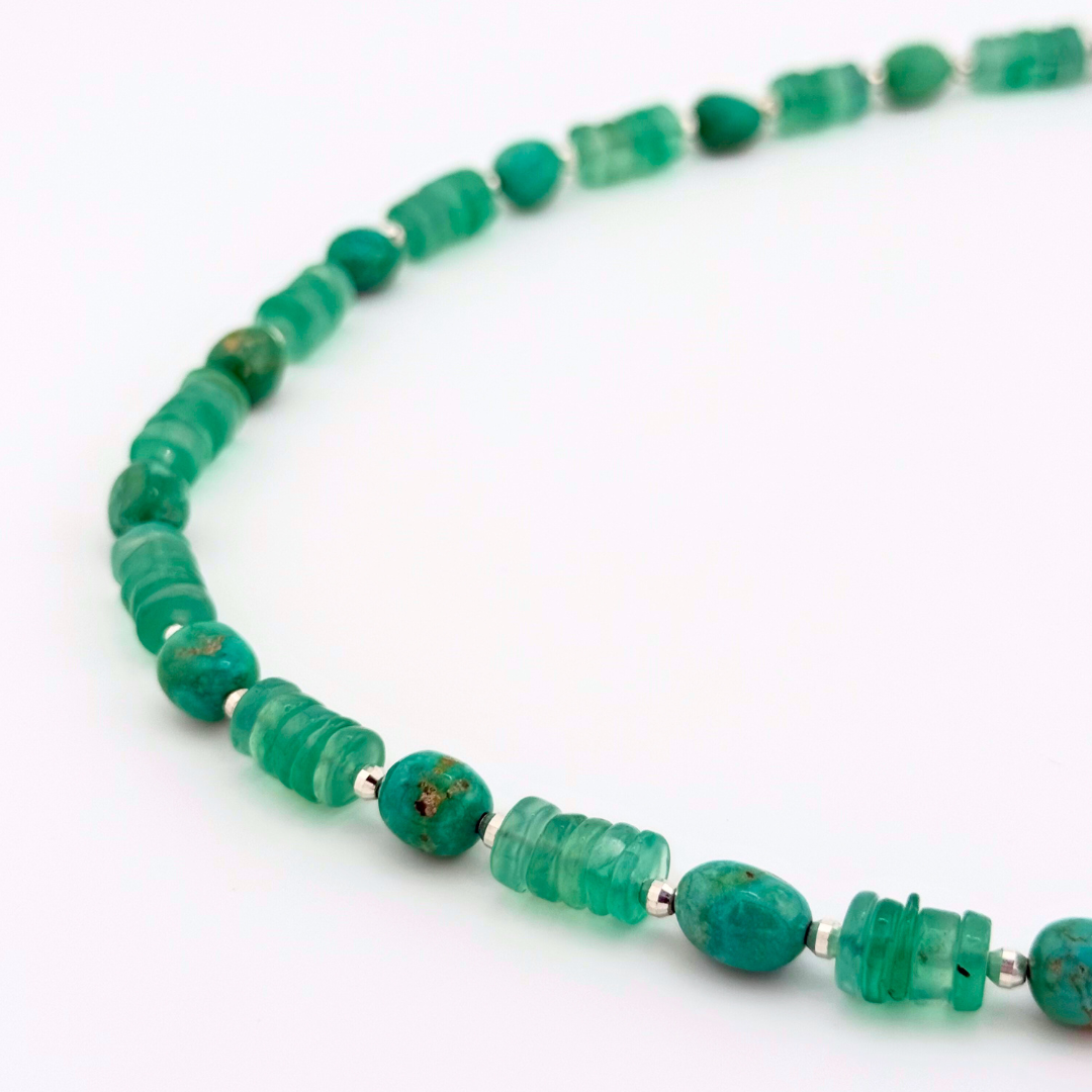 Chrysophrase, Turquoise, Hematite, and Sterling Silver beaded necklace closeup on white background