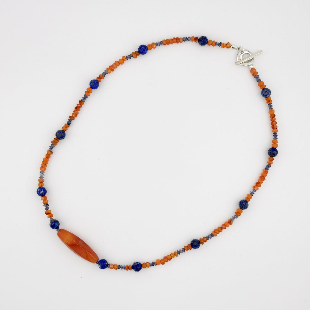 Citrine, Lapis, Sodalite, and Sterling Silver beaded Necklace flatlay on white background