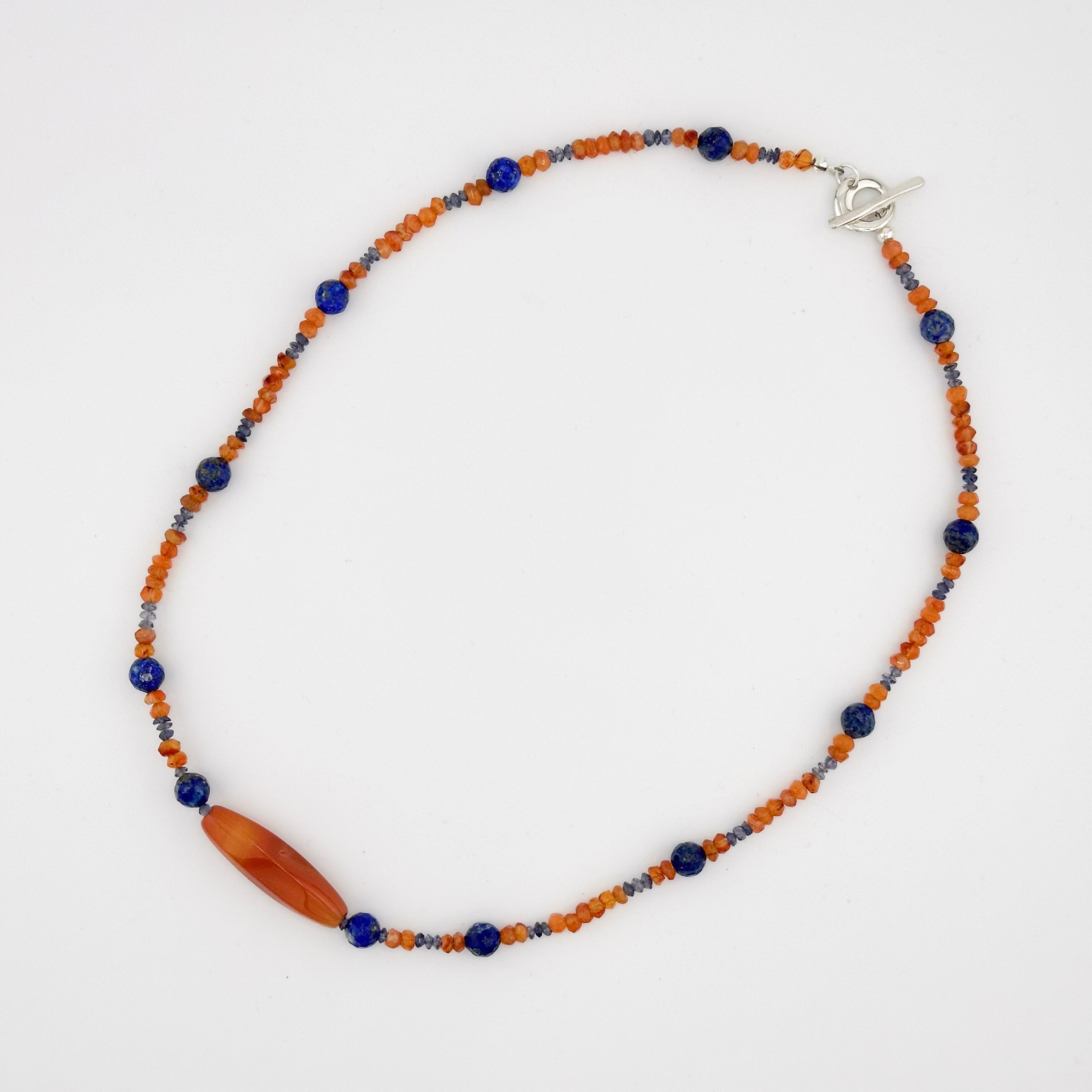 Citrine, Lapis, Sodalite, and Sterling Silver beaded Necklace flatlay on white background