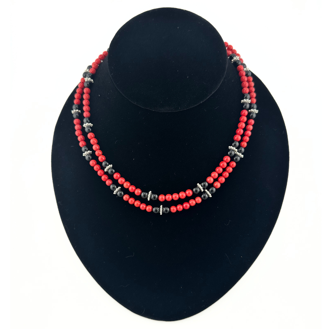 Coral, Onyx, and Sterling Silver Necklace on black bust
