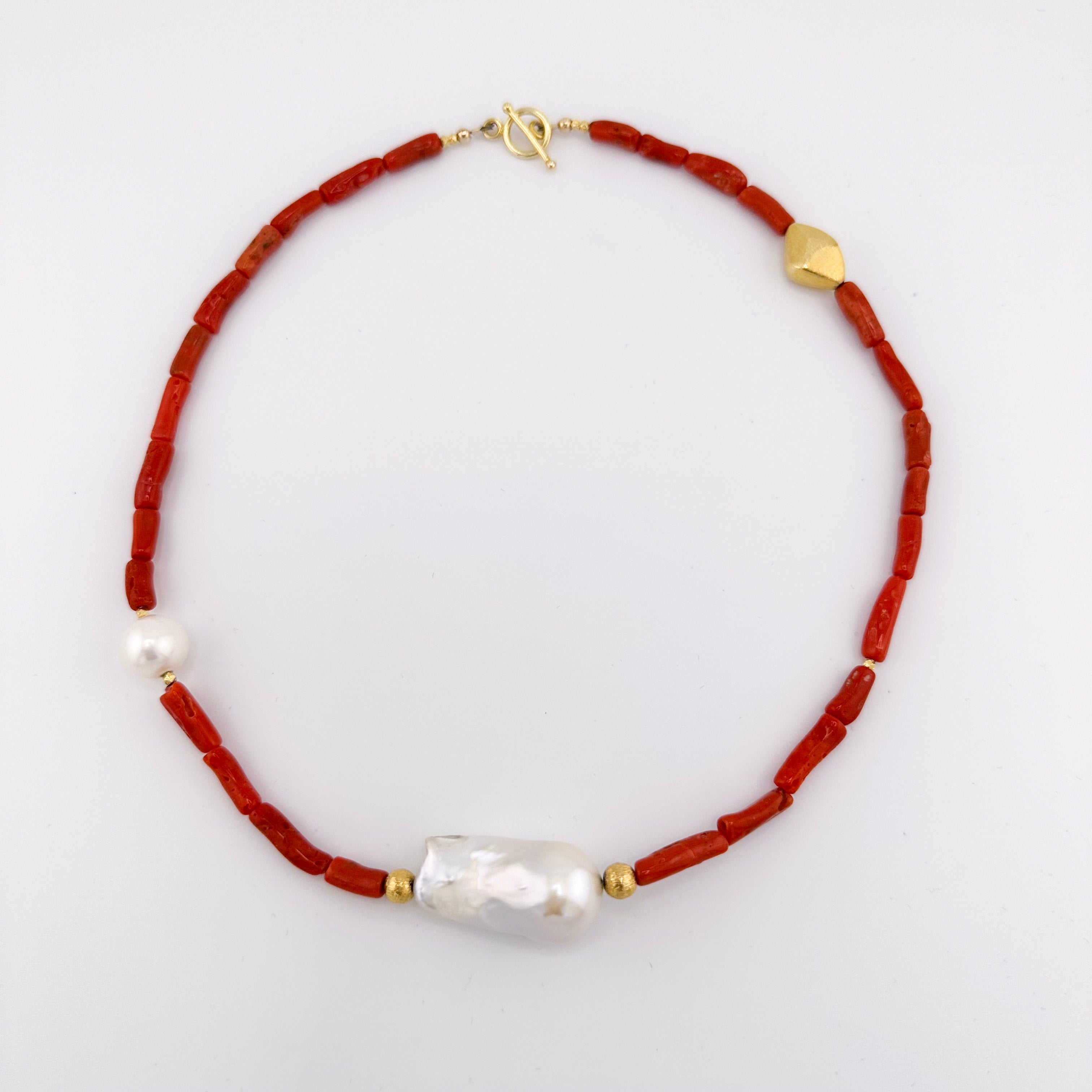 Coral, Pearl, and 22K Gold Vermeil Necklace flatlay on white background