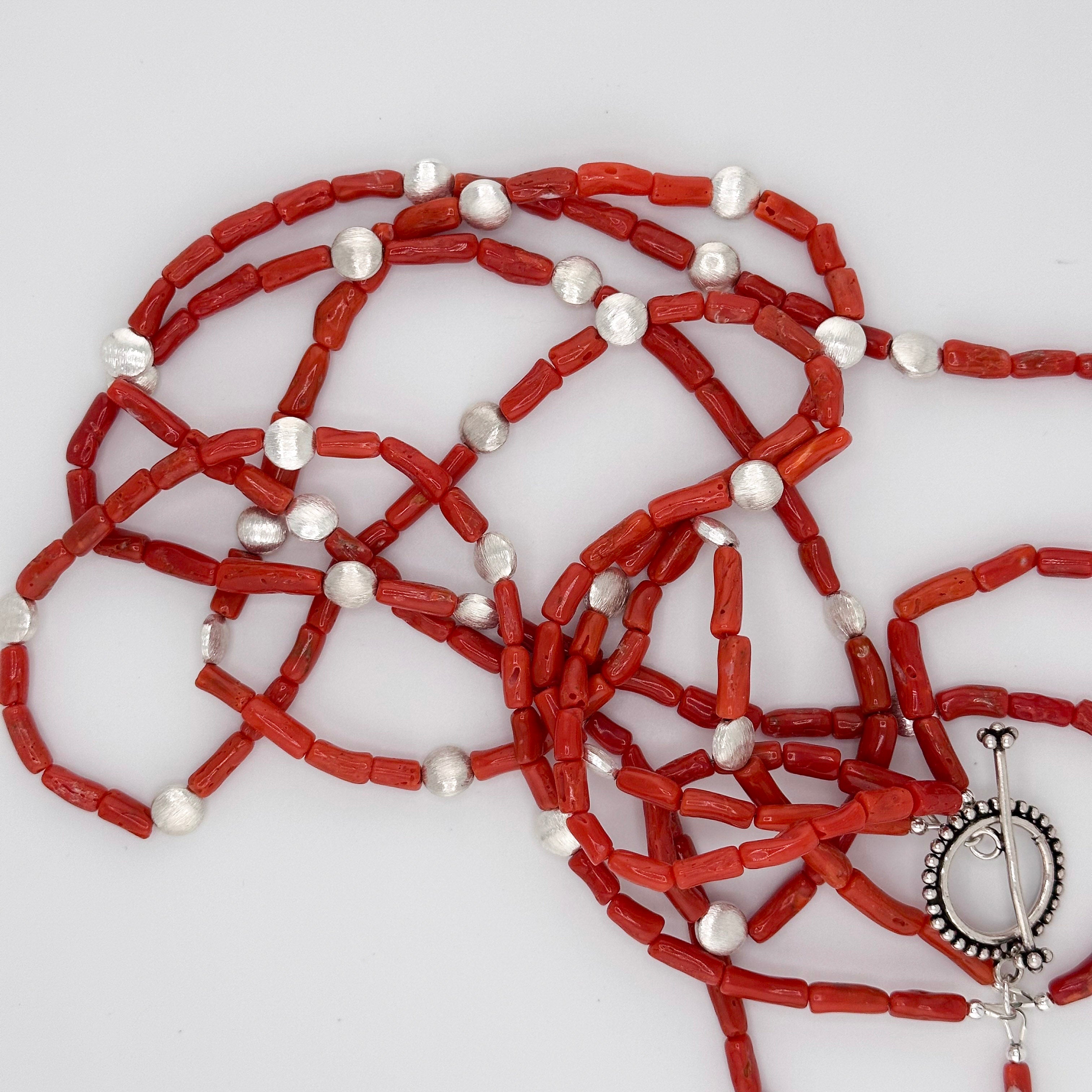 Coral and Sterling Silver Necklace closeup on white background