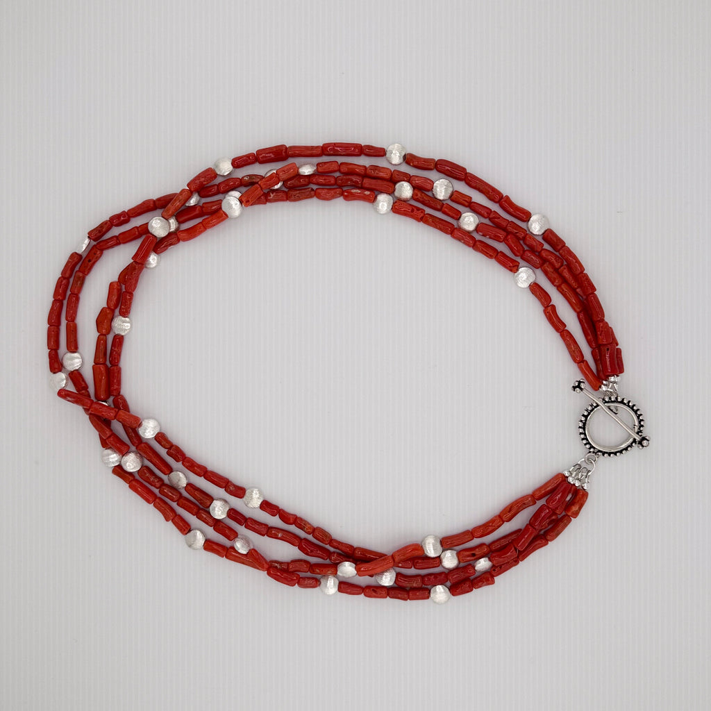Coral and Sterling Silver Necklace flatlay on white background