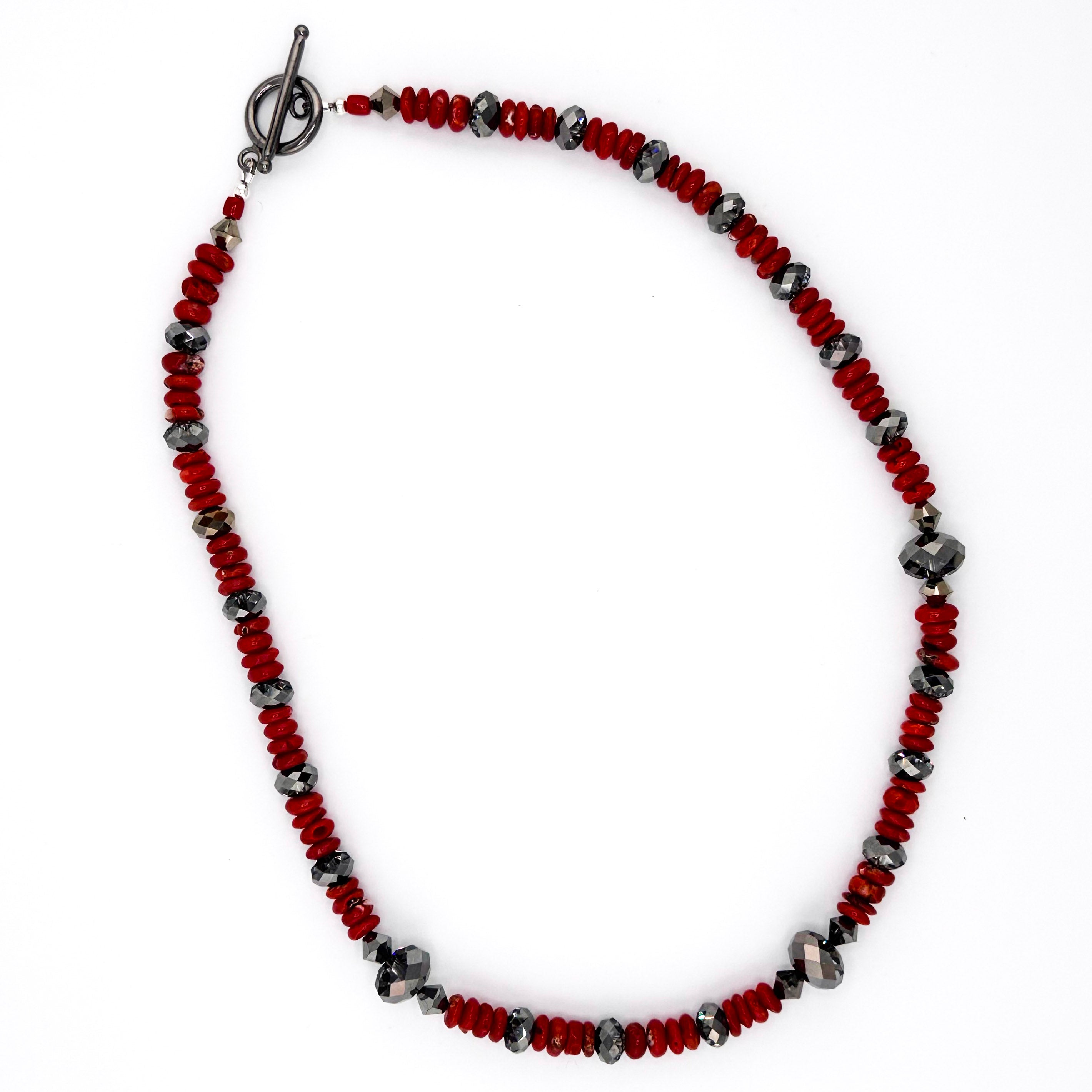 Coral, Swarovski Crystal, and Sterling Silver Necklace flatlay on white background