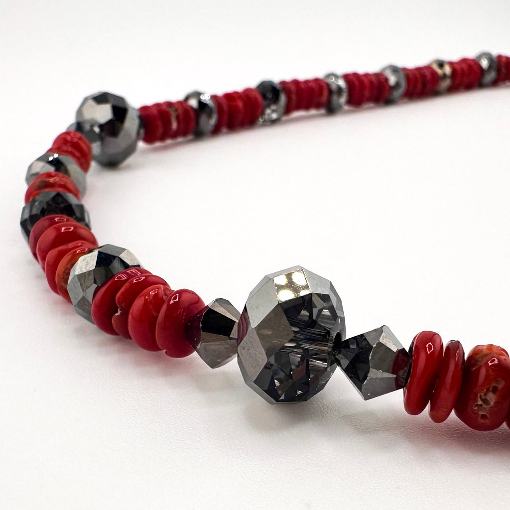 Coral, Swarovski Crystal, and Sterling Silver Necklace closeup on white background