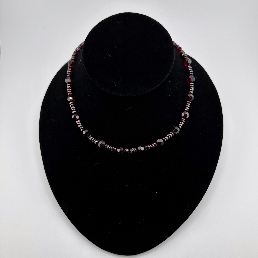 Garnet, Swarovski Crystal, and Sterling Silver Necklace on black bust
