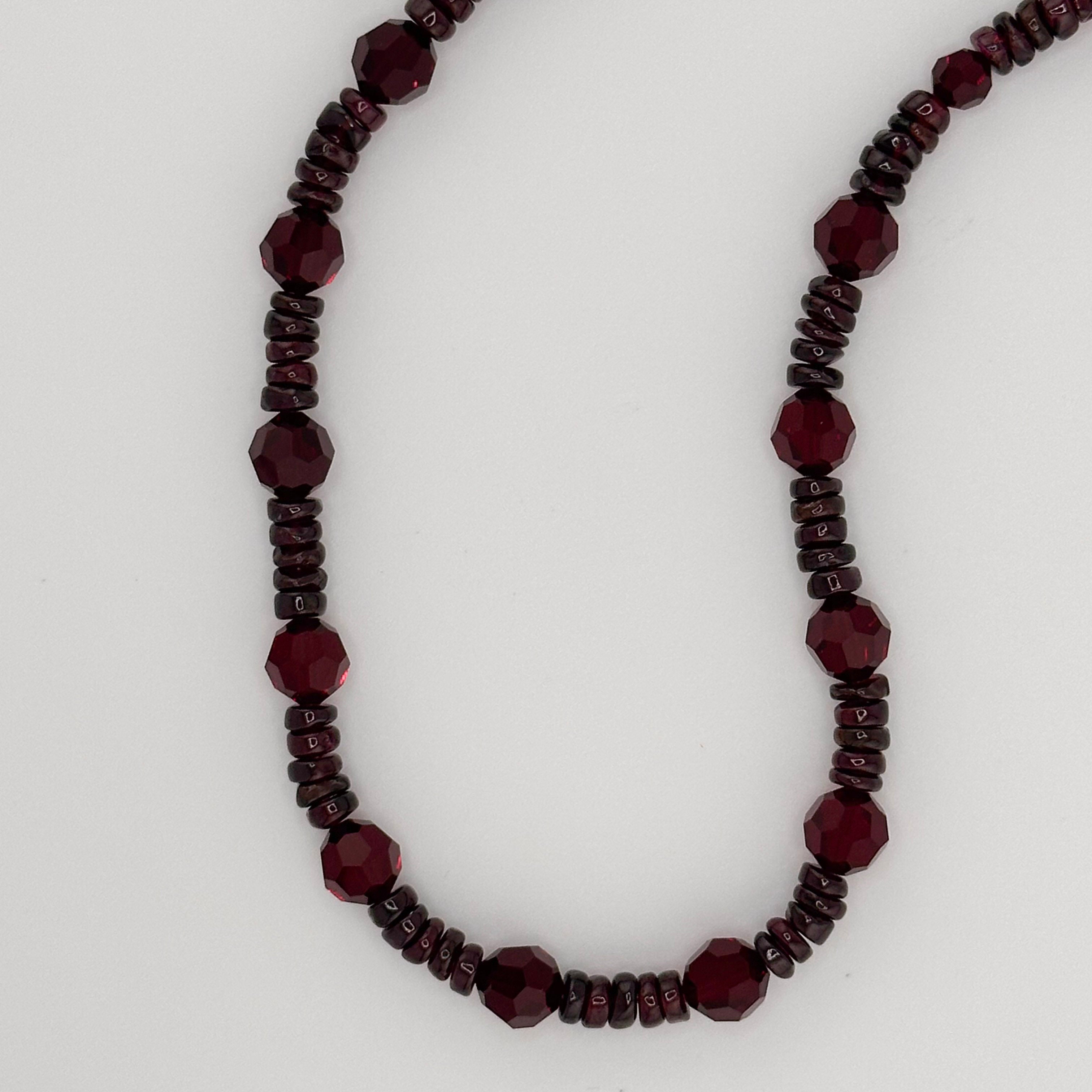 Garnet, Swarovski Crystal, and Sterling Silver Necklace closeup on white background