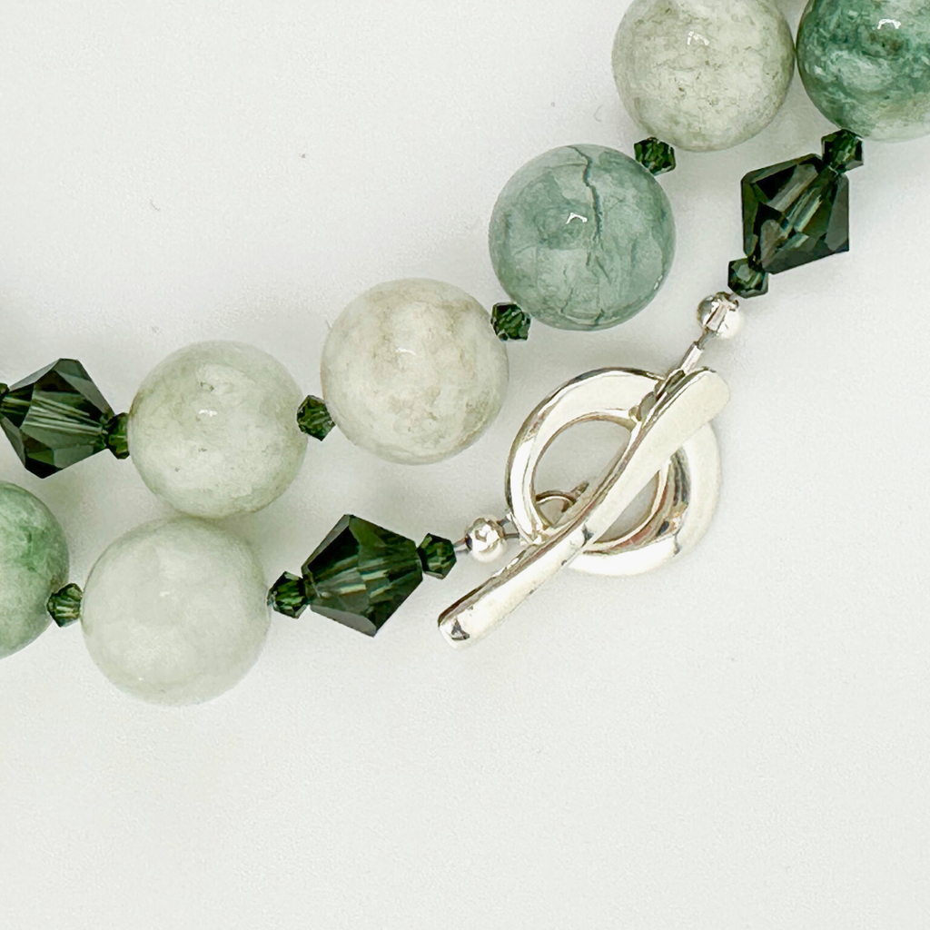 Jade, Swarovski Crystal, and Sterling Silver Necklace close-up on white background