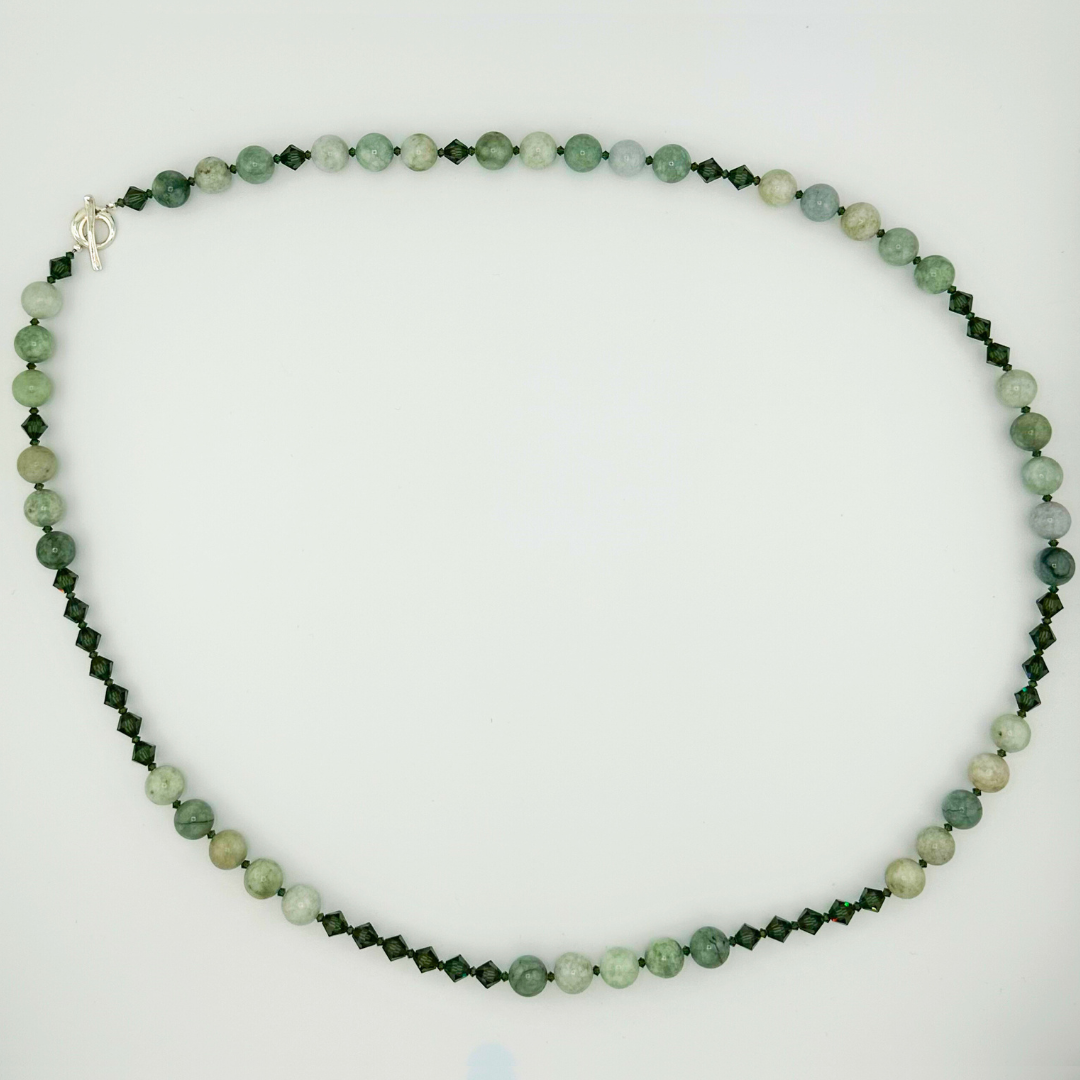 Jade, Swarovski Crystal, and Sterling Silver Necklace flatlay on white background