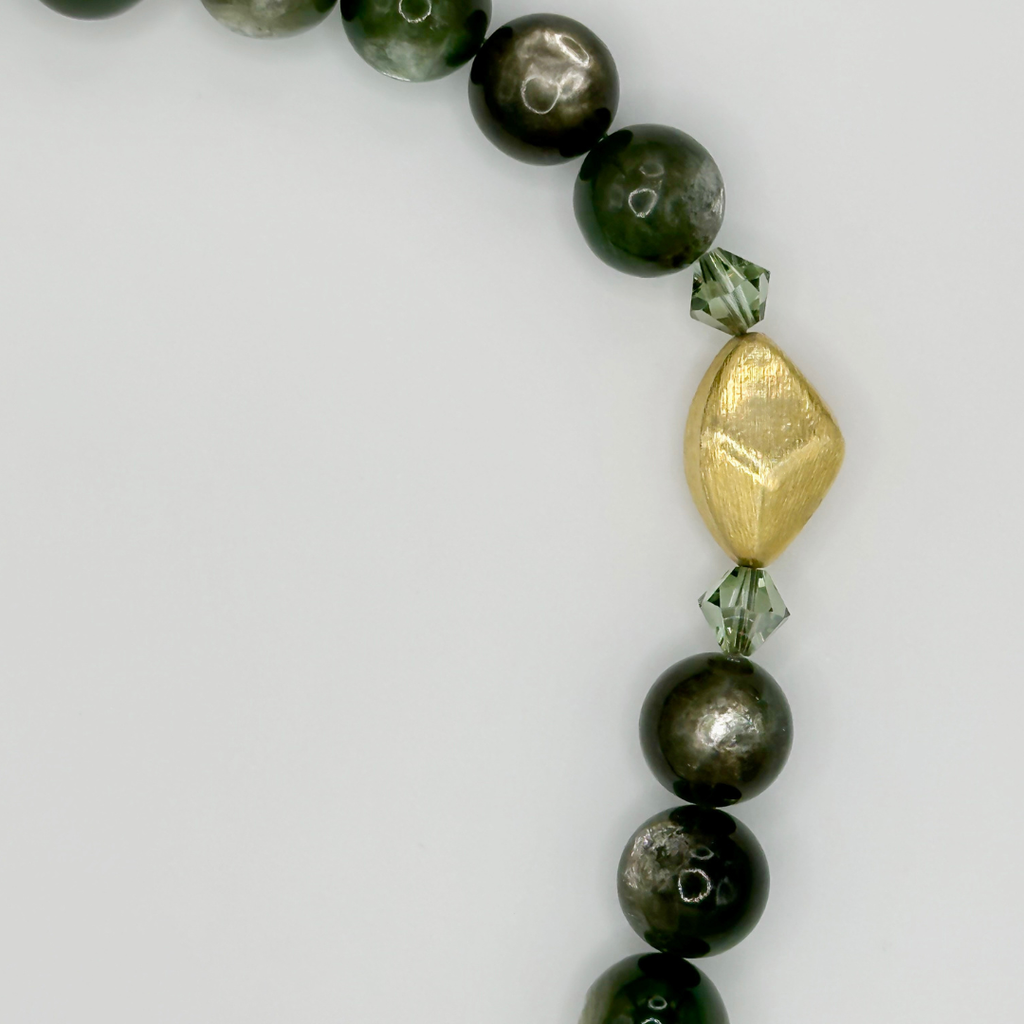 Lepidolite, Swarovski Crystal, and 22K Gold Vermeil beaded necklace closeup on white background
