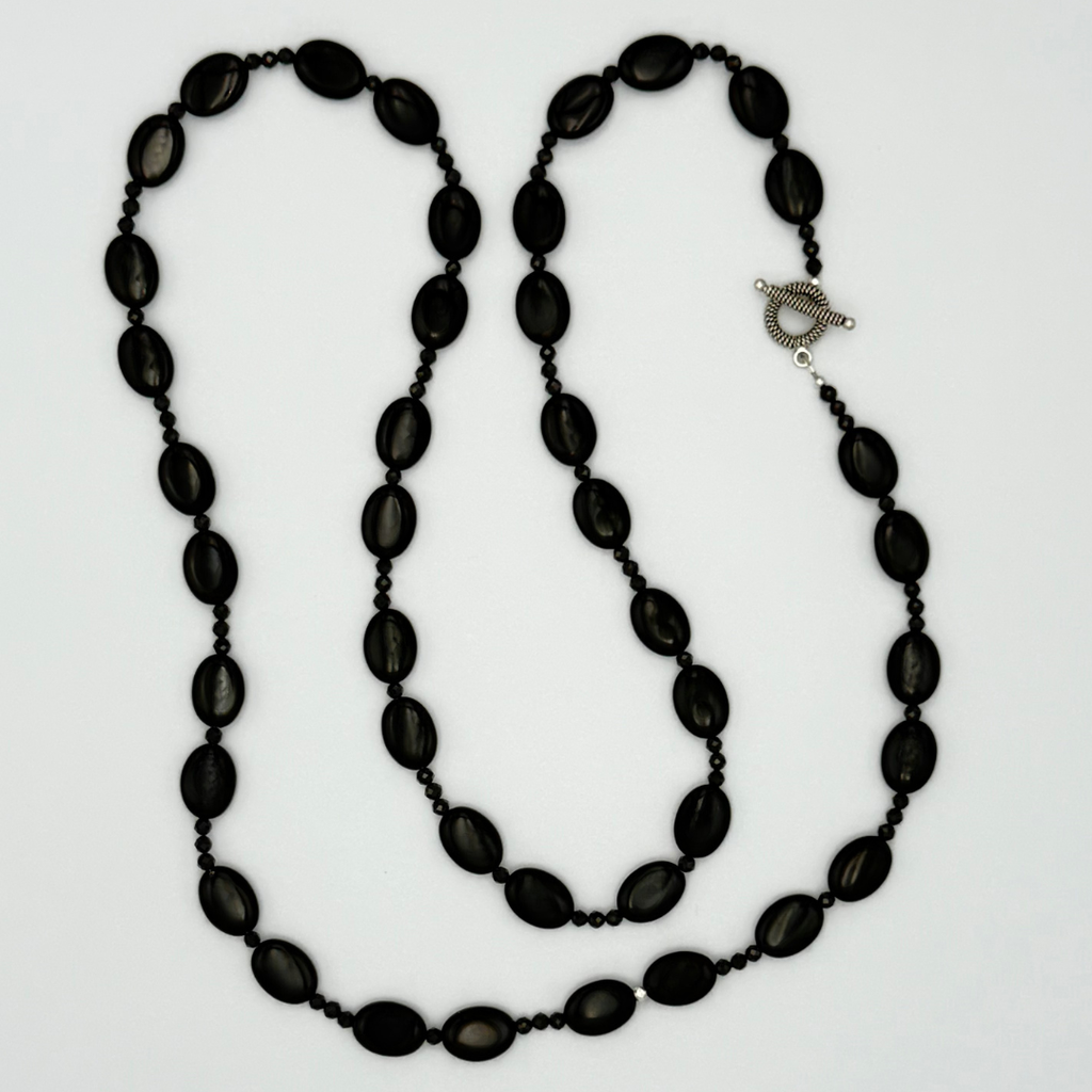 Onyx, Spinel, and Sterling Silver Necklace flatlay on white background