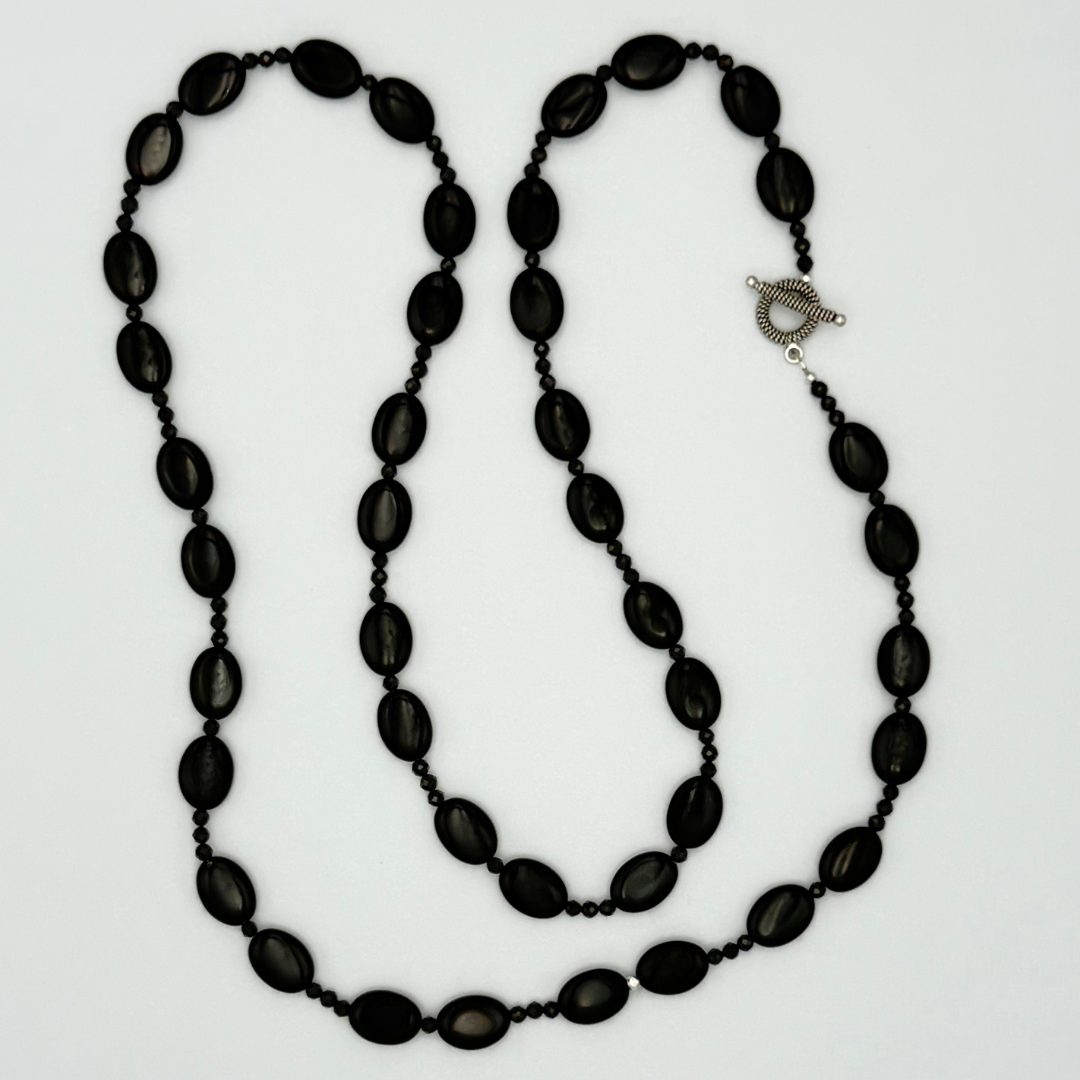 Onyx, Spinel, and Sterling Silver Necklace flatlay on white background
