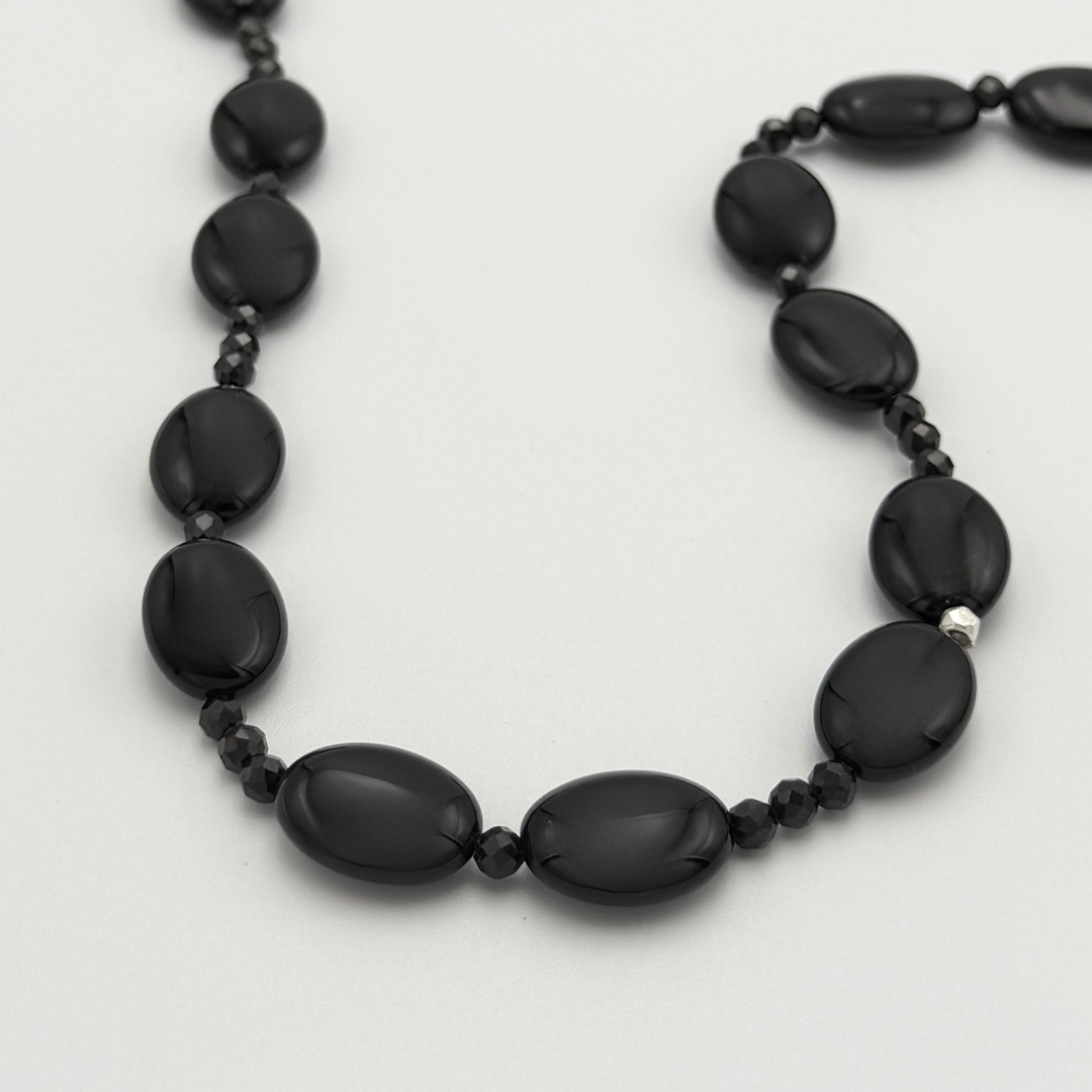 Onyx, Spinel, and Sterling Silver Necklace closeup on white background