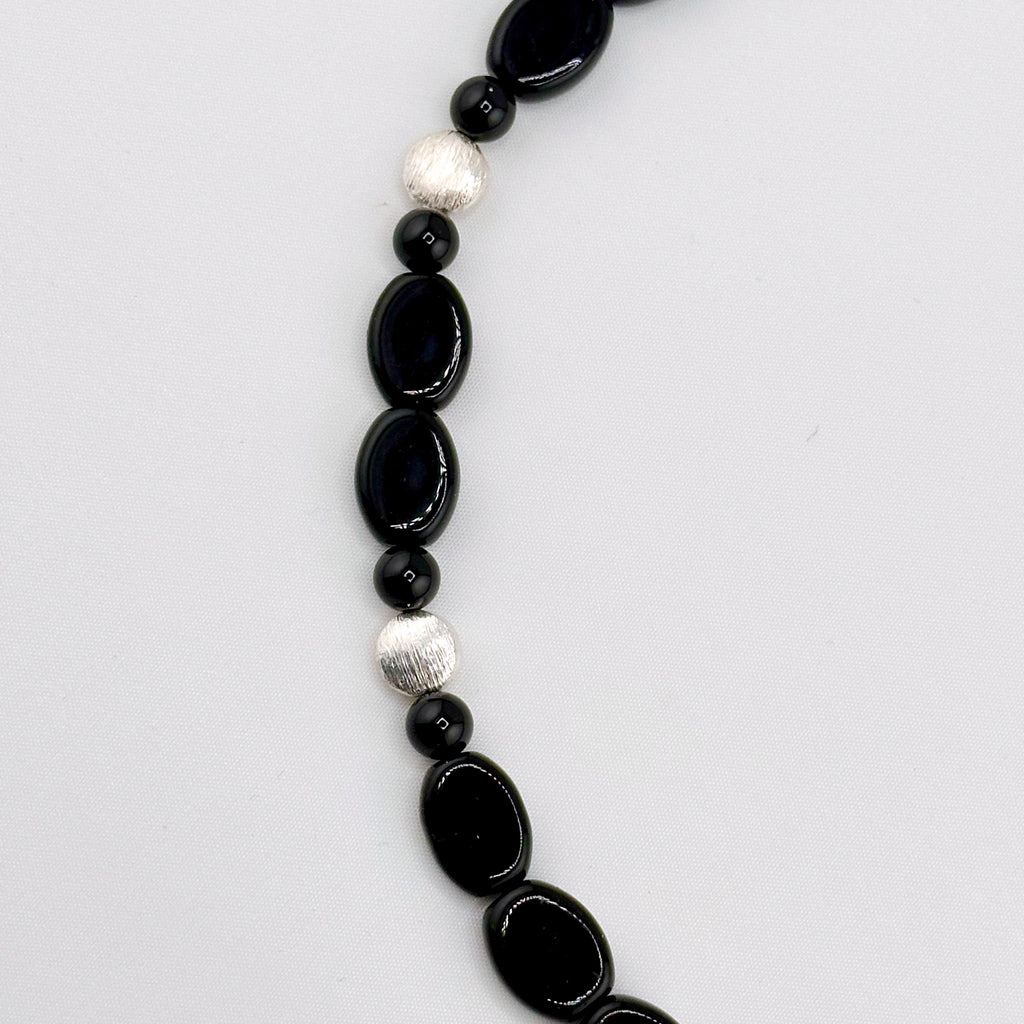 Onyx and Sterling Silver Necklace closeup on white background