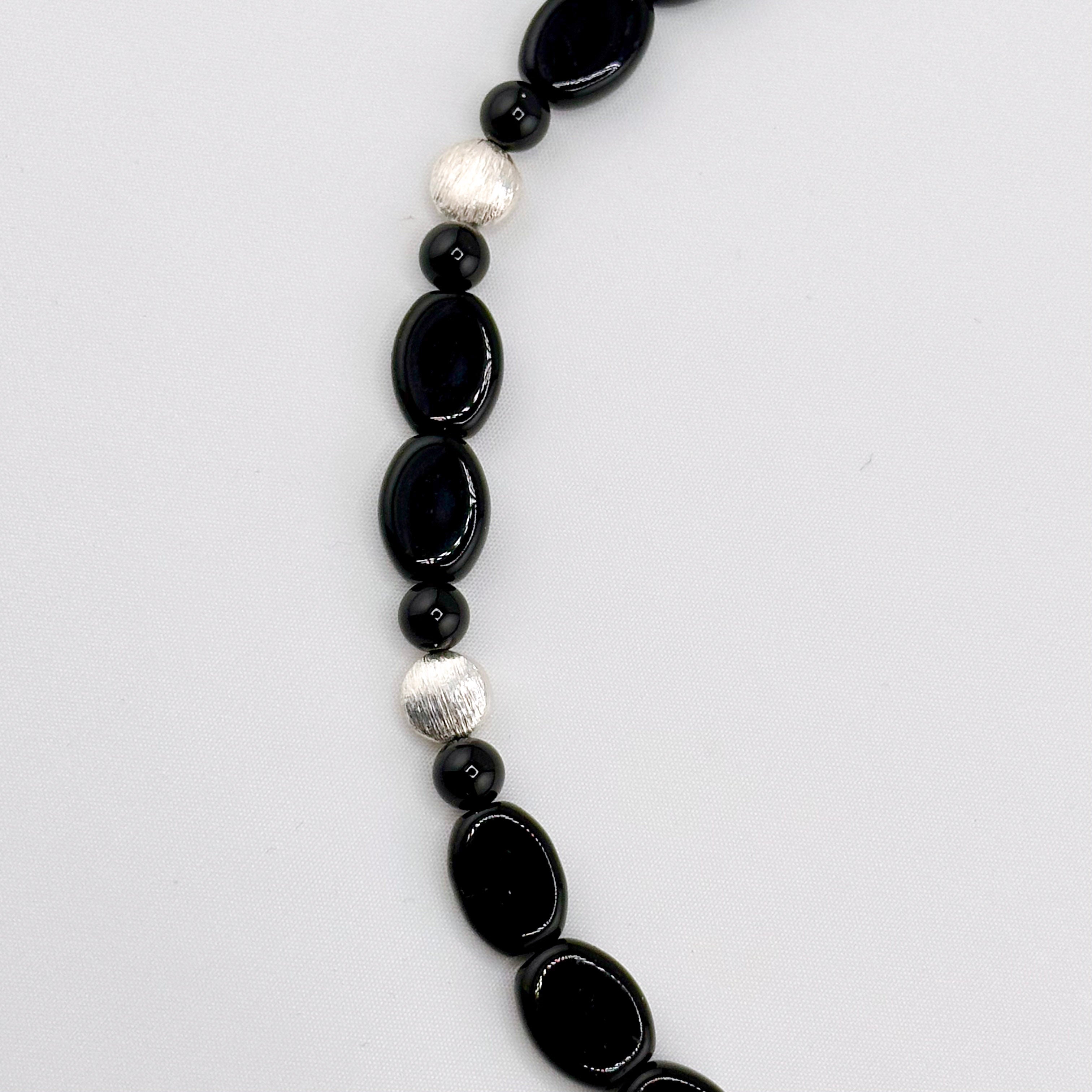 Onyx and Sterling Silver Necklace closeup on white background