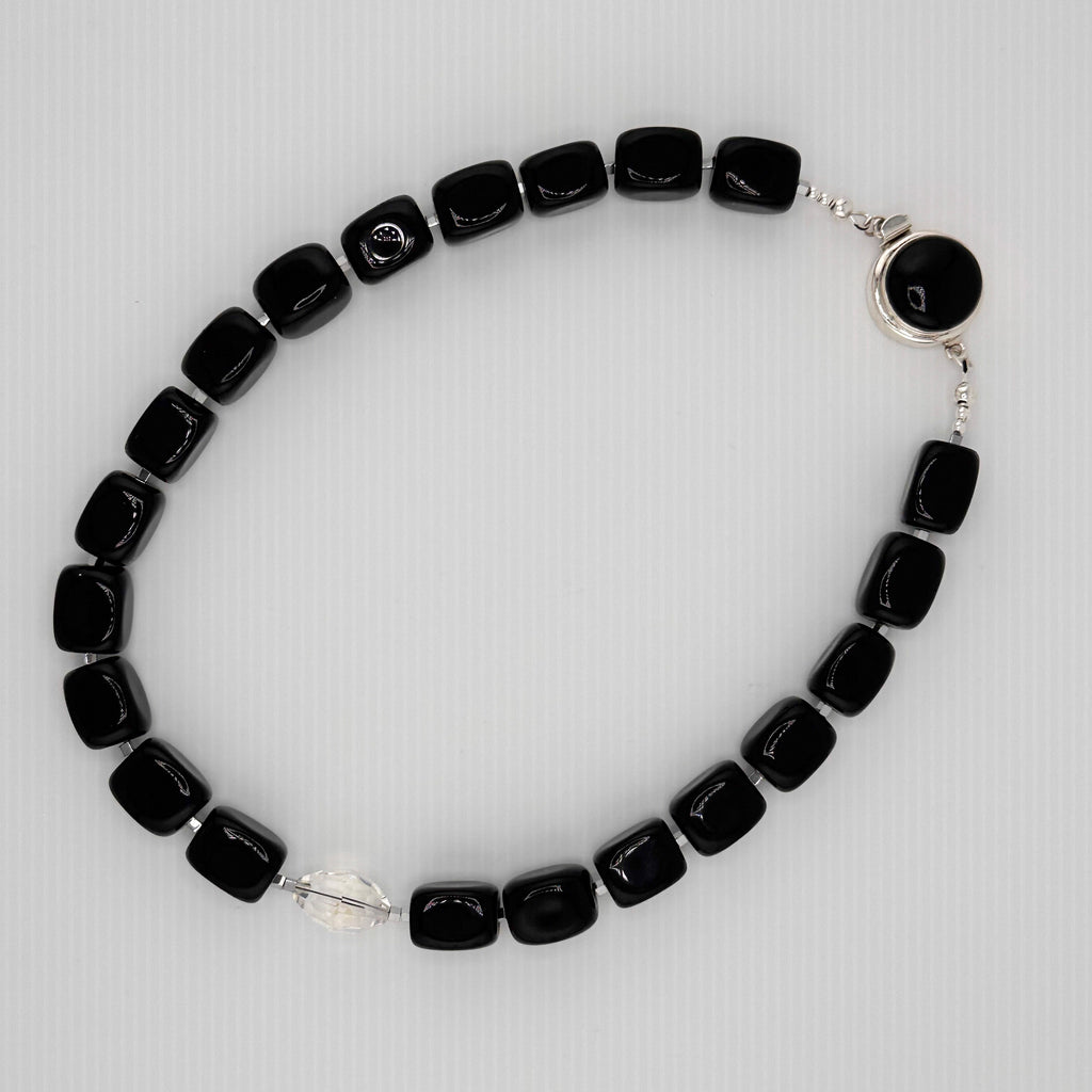 Onyx, Hematite, Swarovski Crystal, and Sterling Silver Necklace flatlay on white background