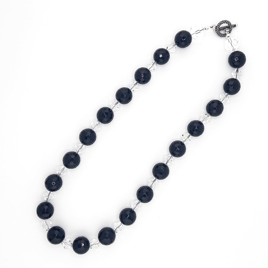Onyx, Swarovski Crystal, and Sterling Silver Necklace flatlay on white background