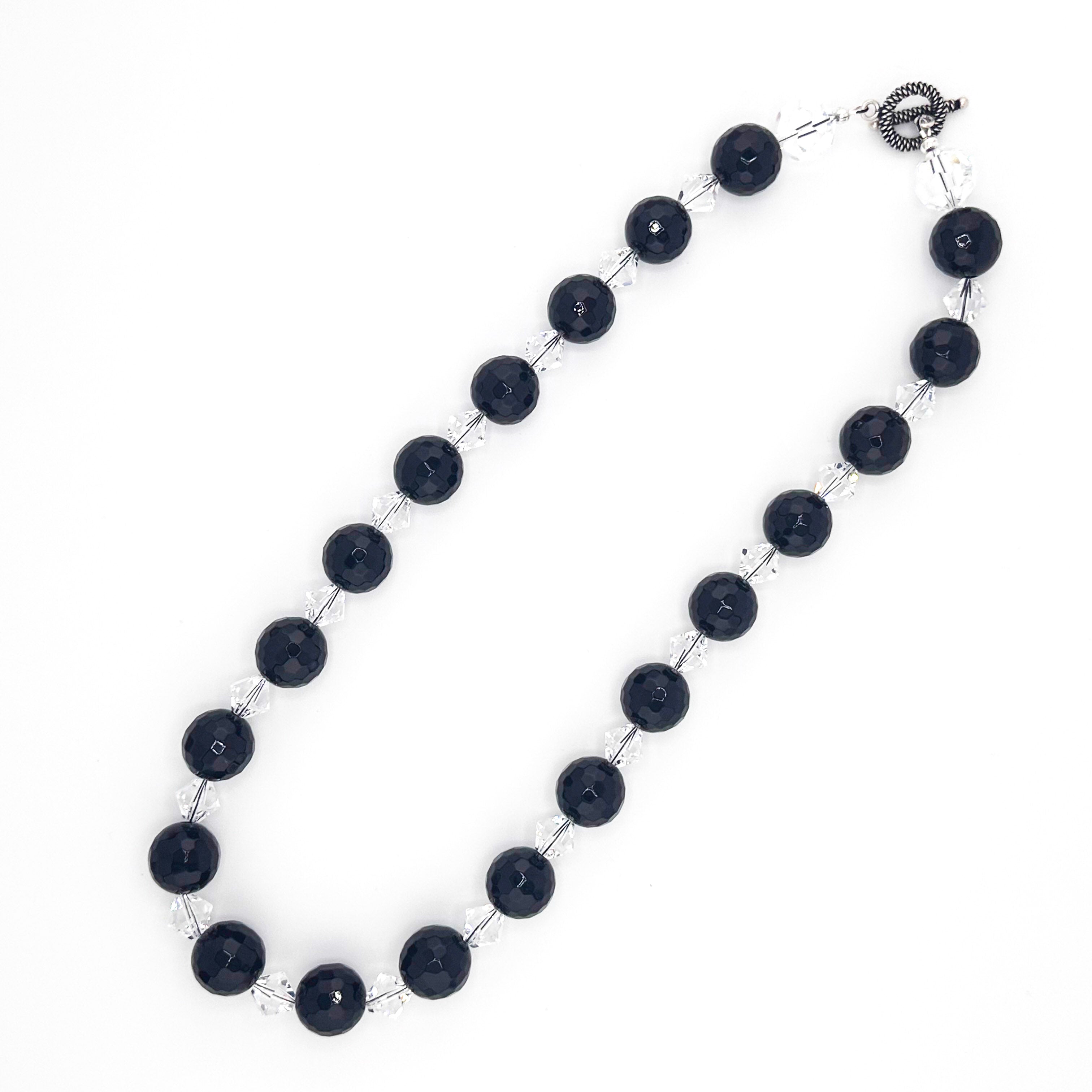 Onyx, Swarovski Crystal, and Sterling Silver Necklace flatlay on white background