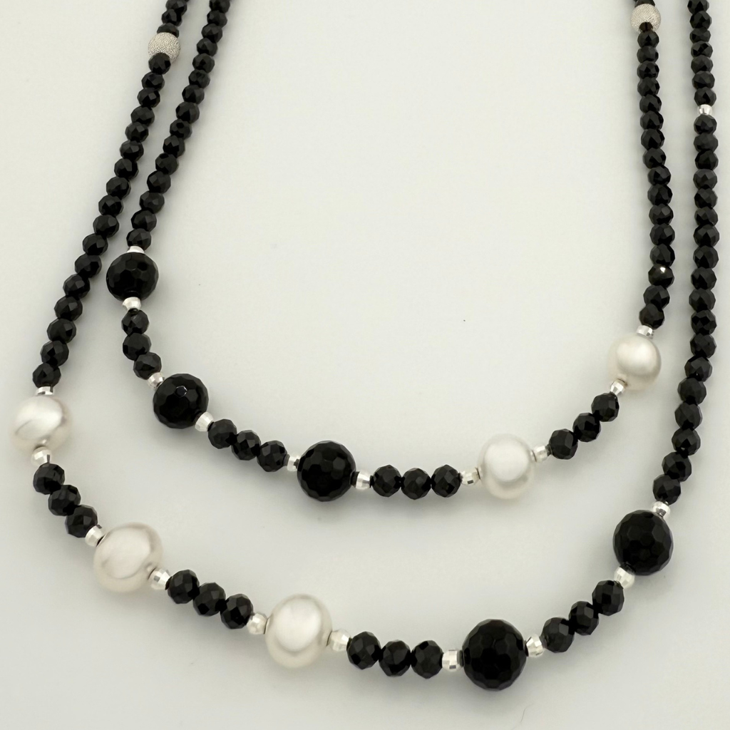 Pearl, Spinel, Onyx, and Sterling Silver Necklace closeup on white background
