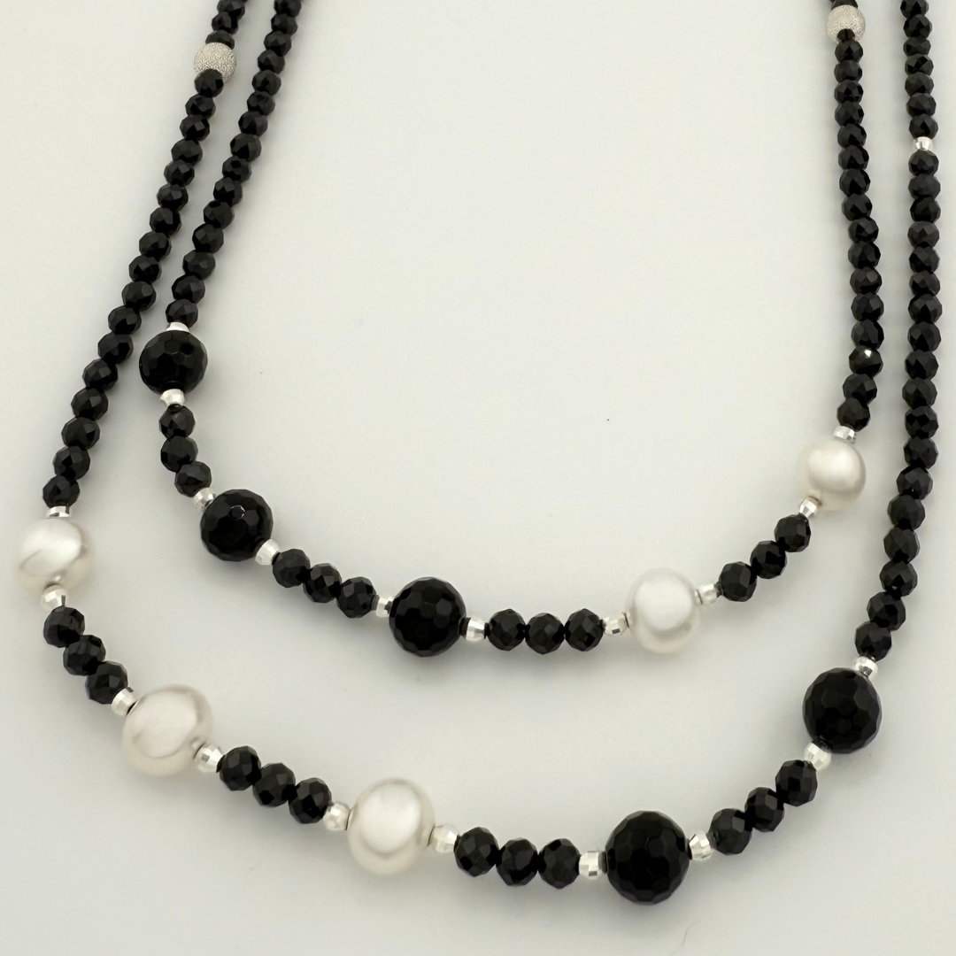 Pearl, Spinel, Onyx, and Sterling Silver Necklace closeup on white background