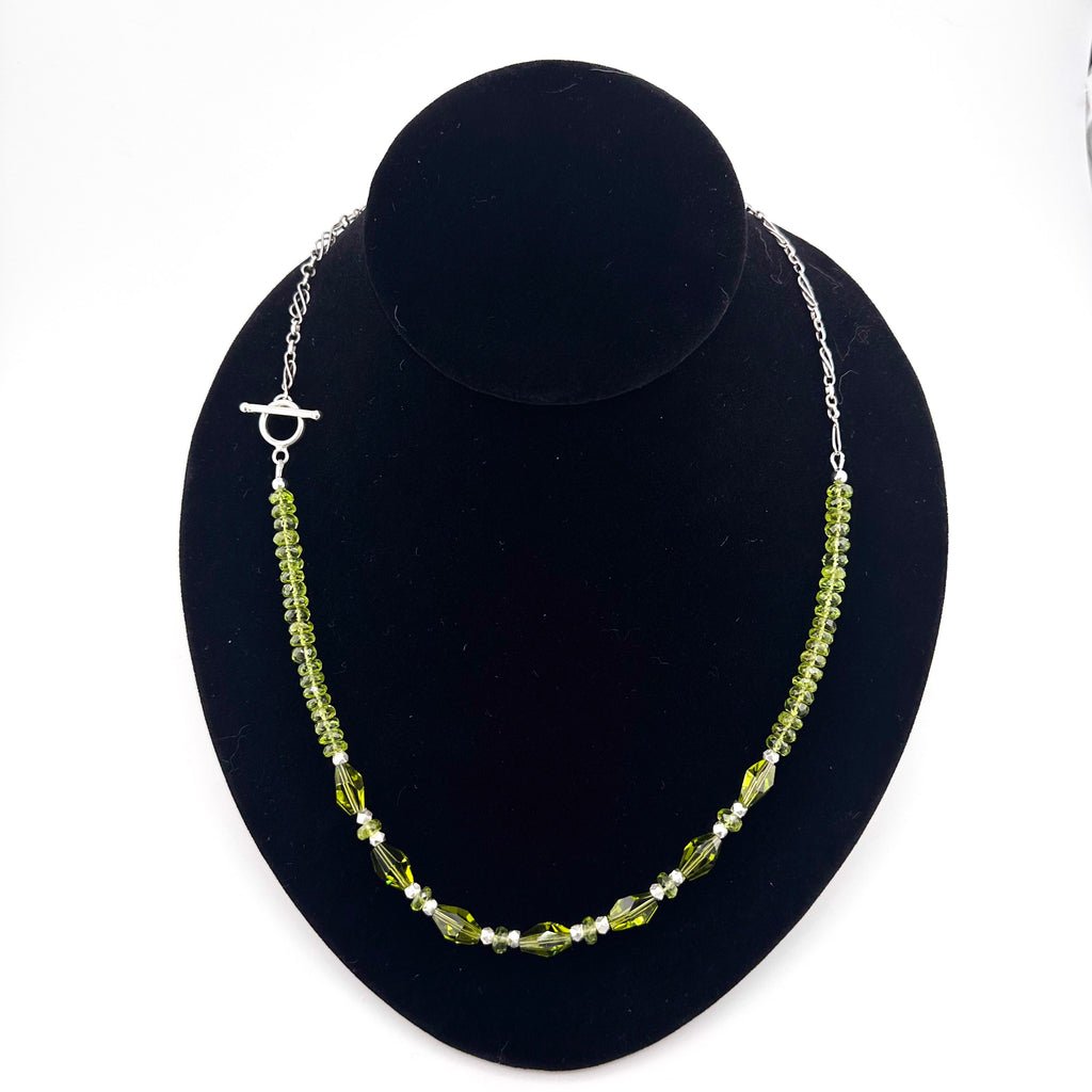 Peridot, Swarovski Crystal, and Sterling Silver Necklace on black bust