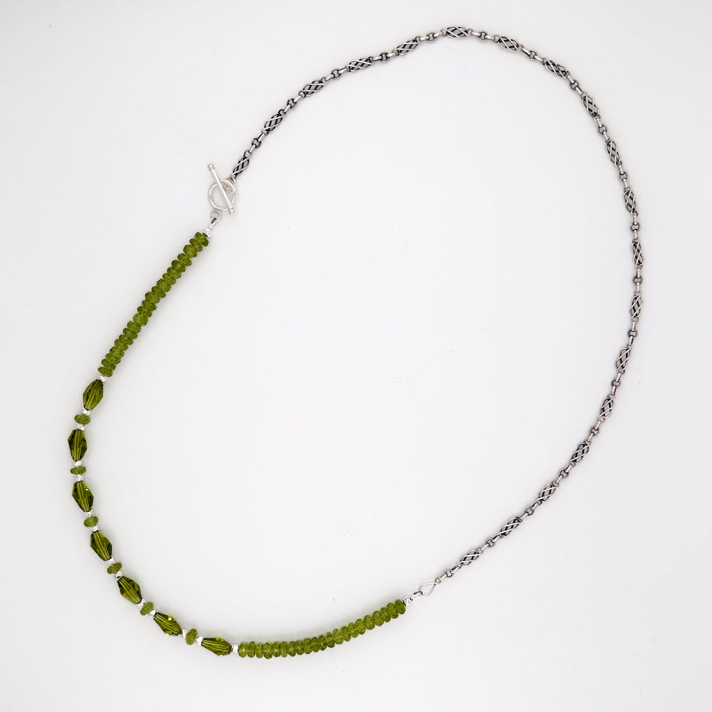 Peridot, Swarovski Crystal, and Sterling Silver Necklace flatlay on white background