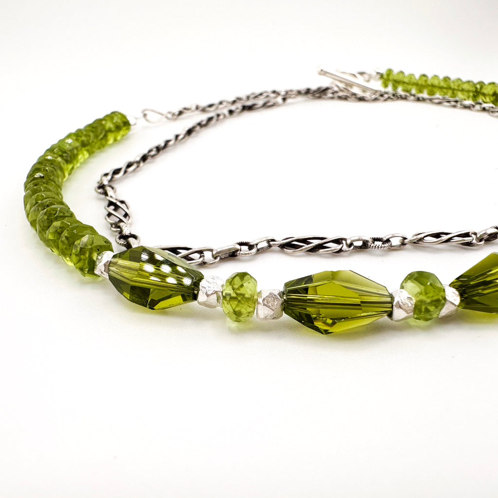 Peridot, Swarovski Crystal, and Sterling Silver Necklace closeup on white background