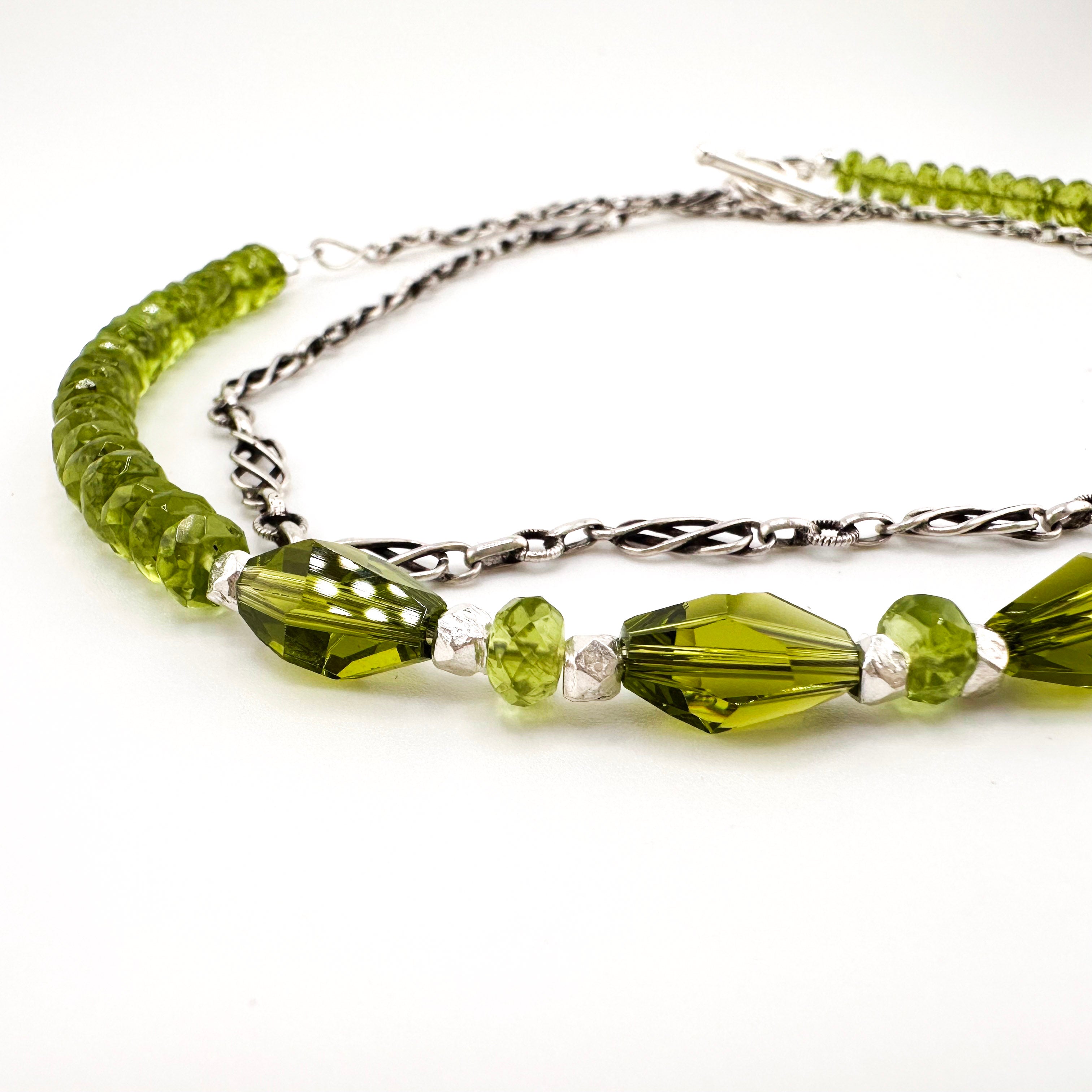 Peridot, Swarovski Crystal, and Sterling Silver Necklace closeup on white background