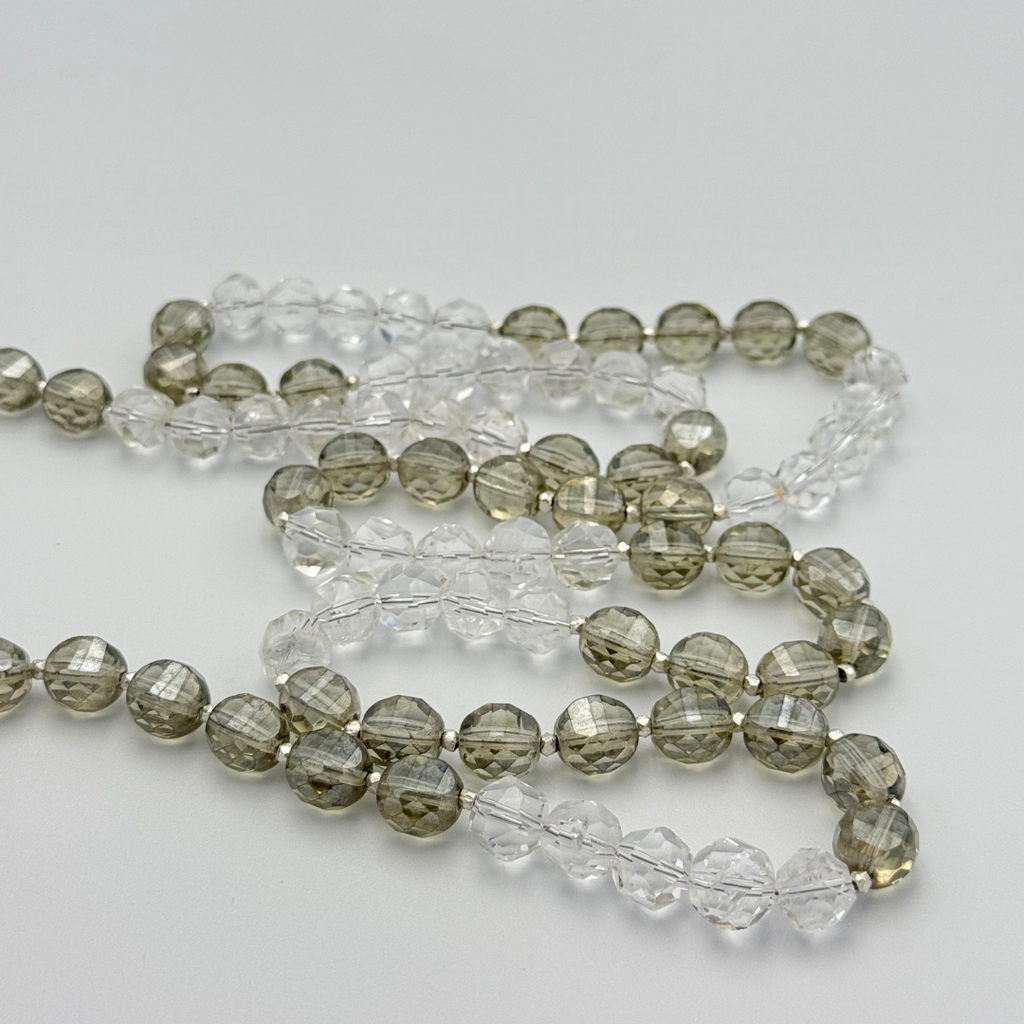 Quartz, Crystal, and Sterling Silver Necklace detail on white background