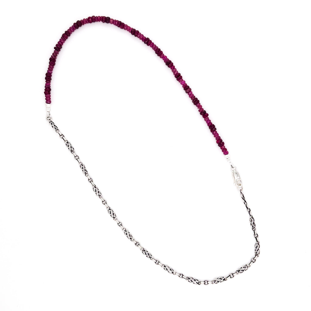 Ruby, Sapphire, and Sterling Silver Necklace flatlay on white background