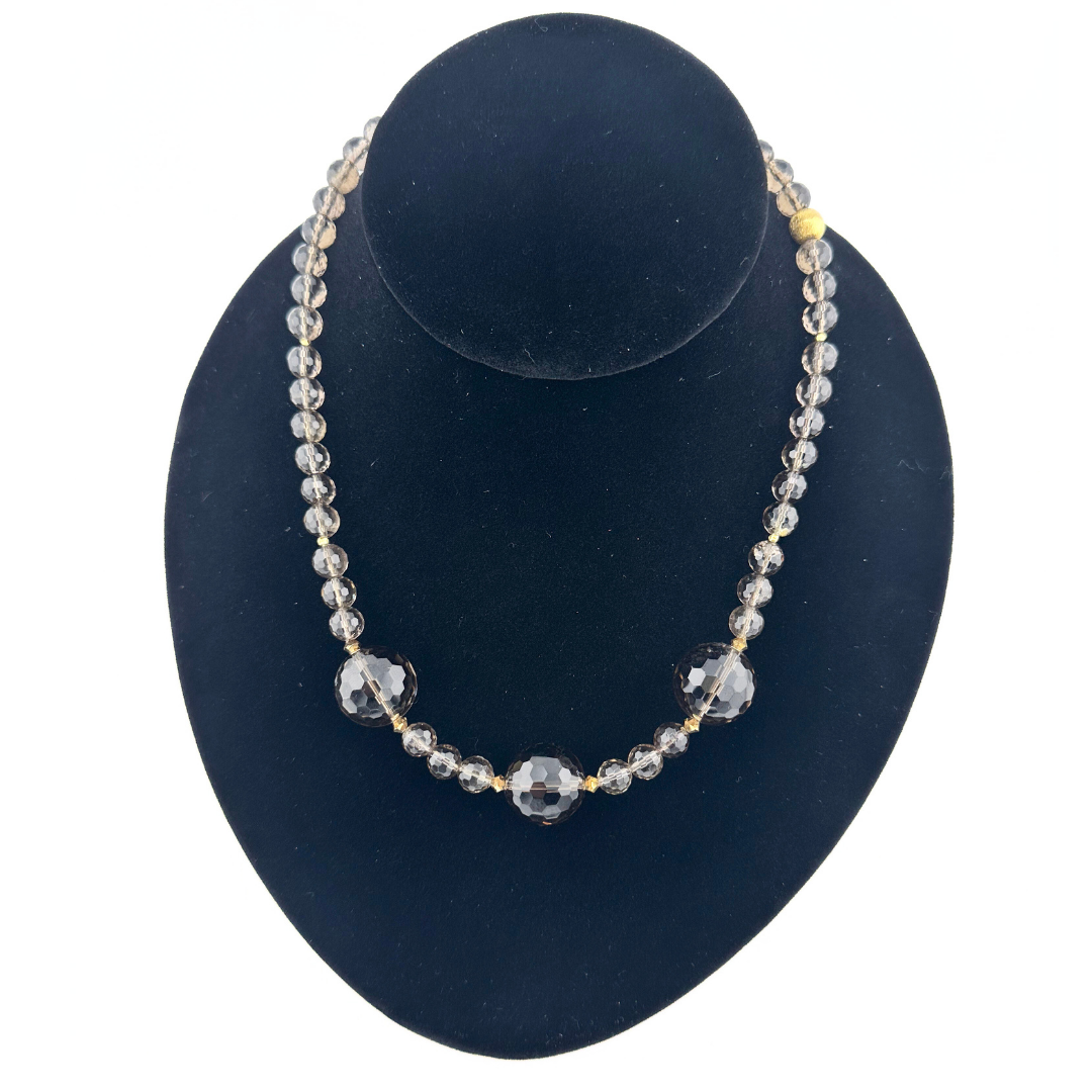 Smoky Quartz, Swarovski Crystal, and 22K Gold Vermeil Necklace on black bust
