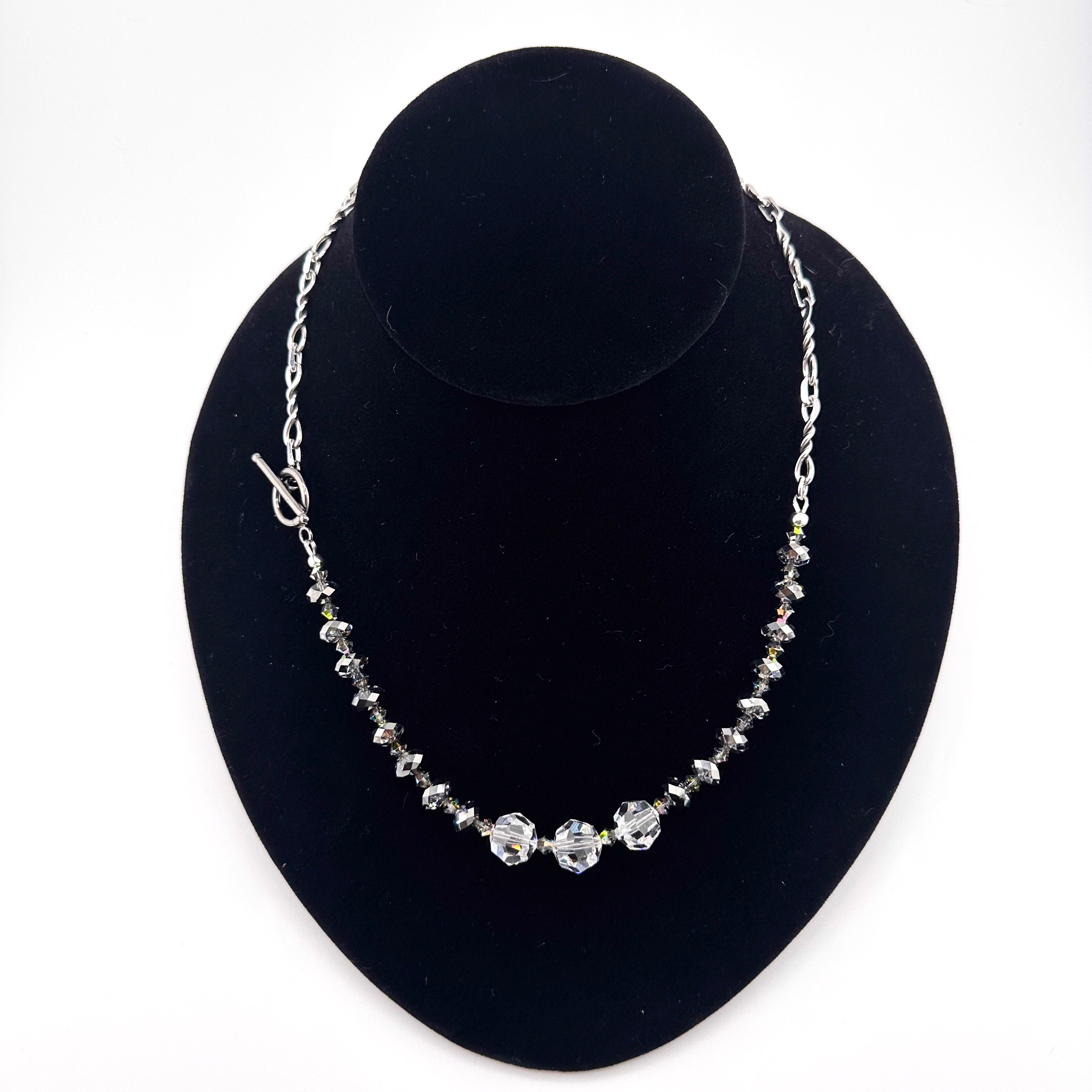 Swarovski Crystal and Sterling Silver 19” Necklace on black bust