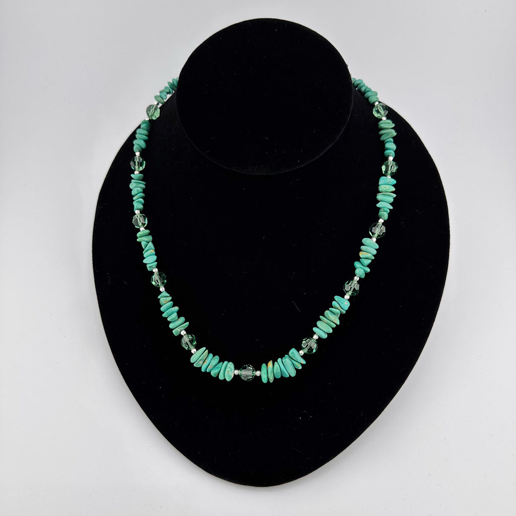 Turquoise, Swarovski Crystal, and Sterling Silver Necklace on black bust