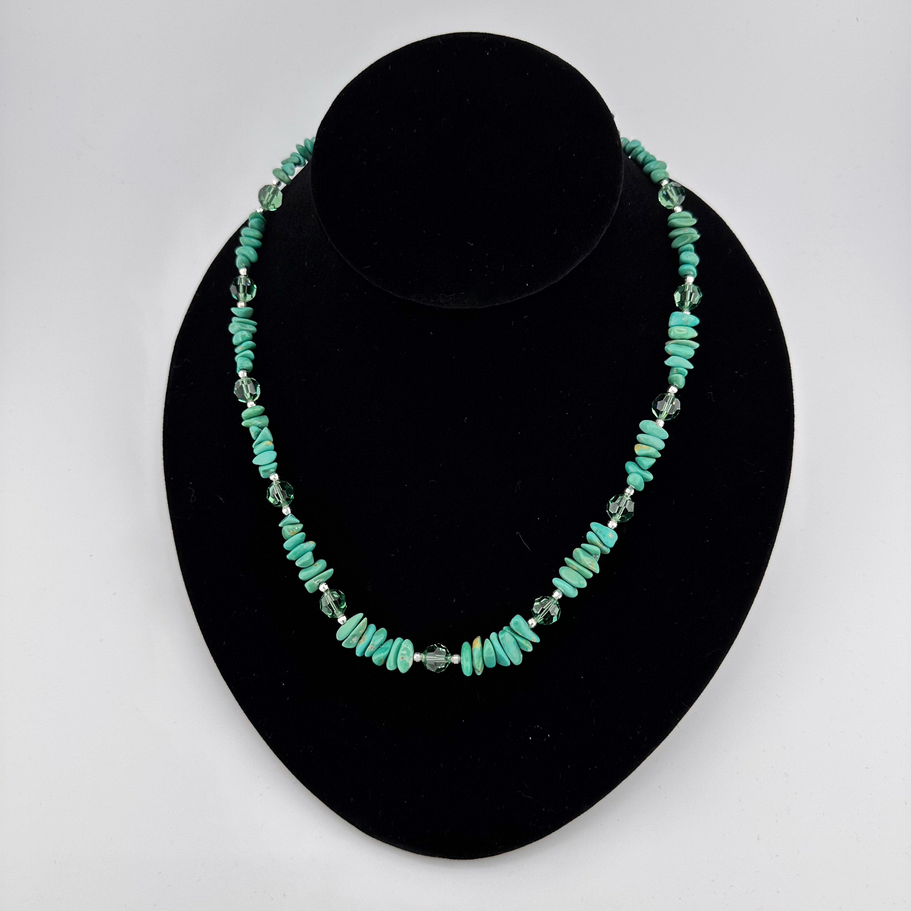 Turquoise, Swarovski Crystal, and Sterling Silver Necklace on black bust