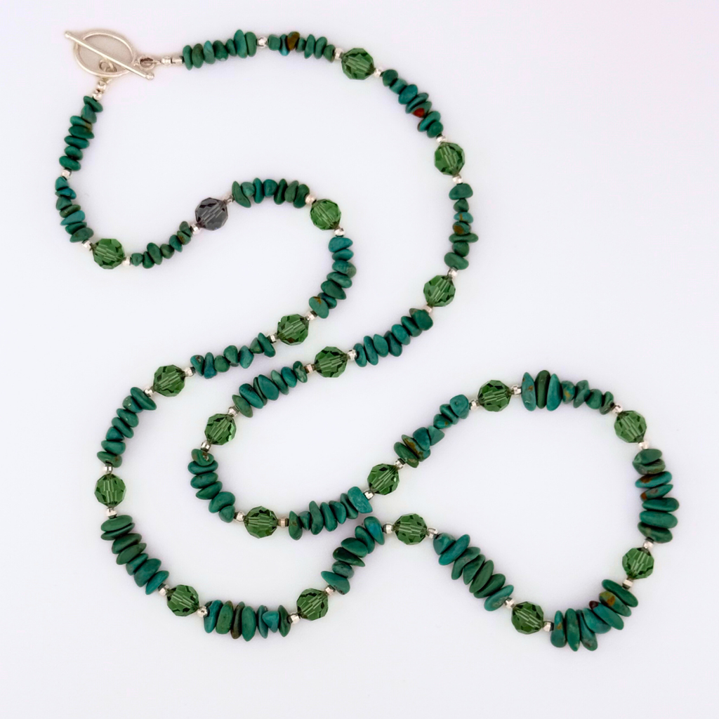 Turquoise, Swarovski Crystal, and Sterling Silver Necklace flatlay on white background