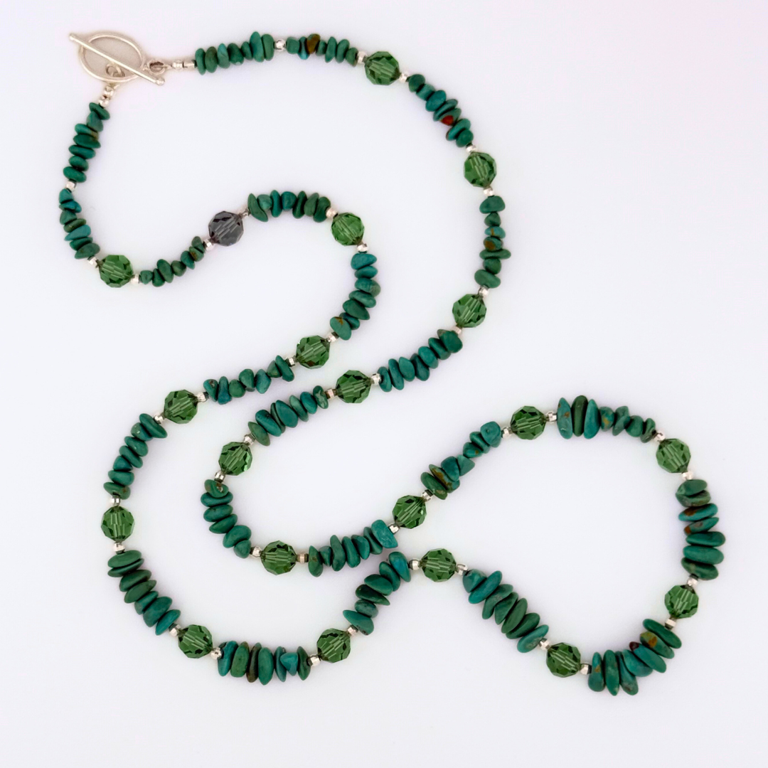 Turquoise, Swarovski Crystal, and Sterling Silver Necklace flatlay on white background