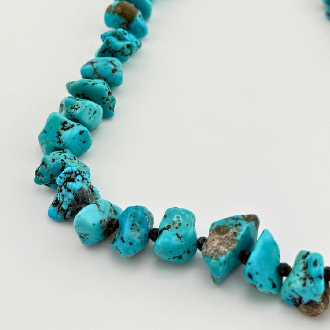 Turquoise, Spinel, Quartz, and Sterling Silver Necklace close-up on white background