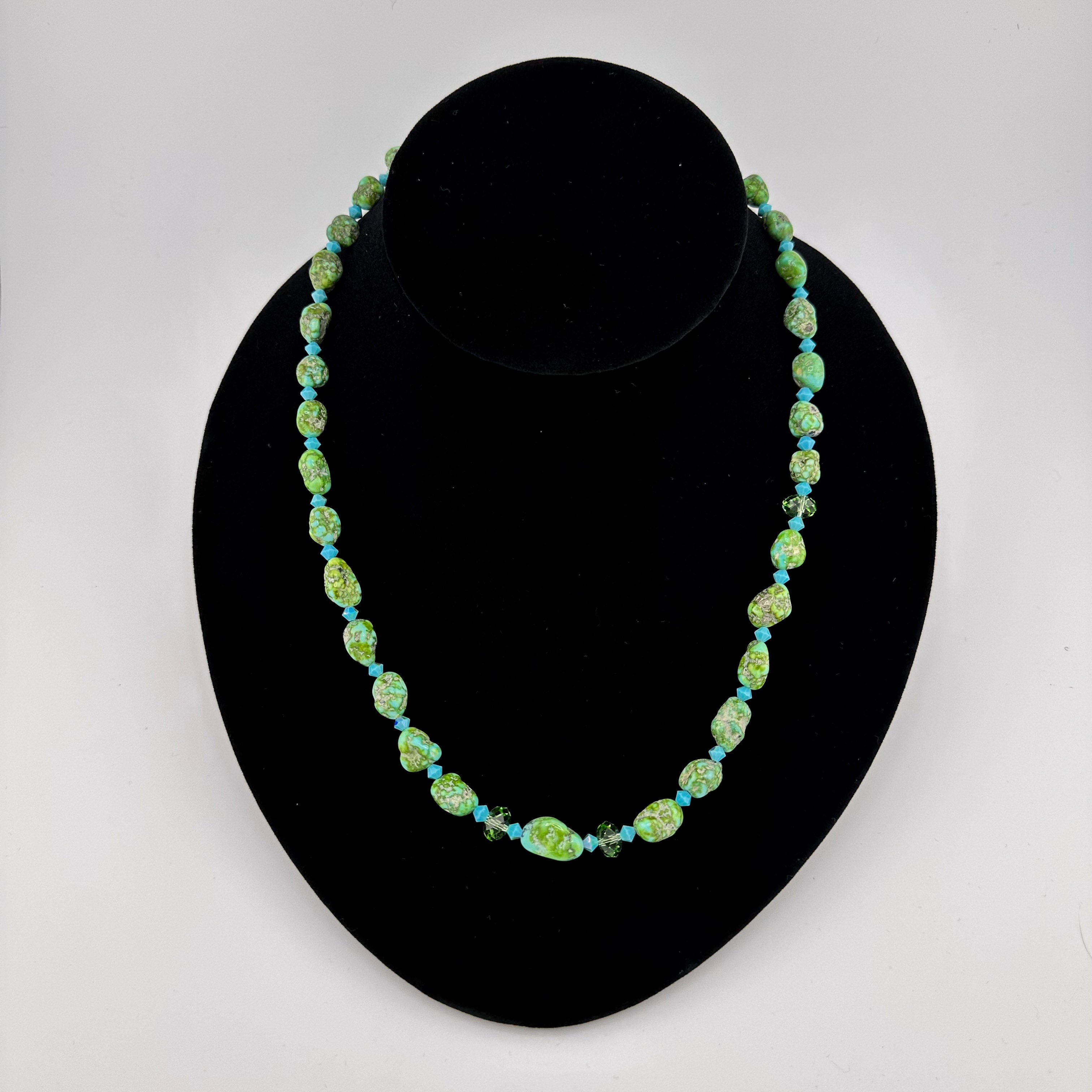 Turquoise, Swarovski Crystal, and Sterling Silver Necklace on black bust