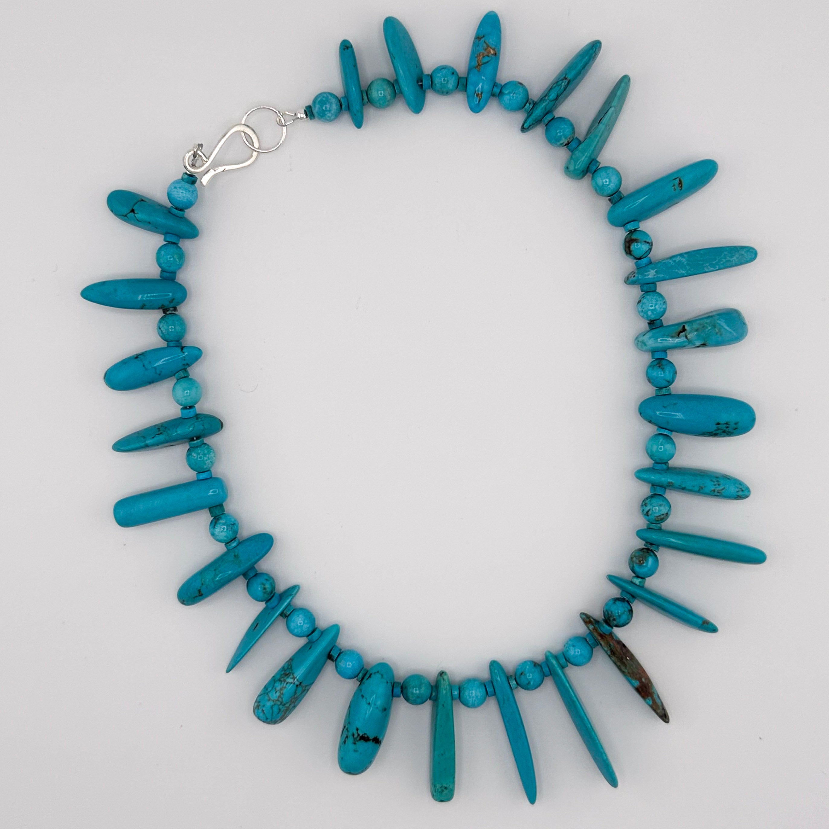 Turquoise and Sterling Silver Necklace flatlay on white background