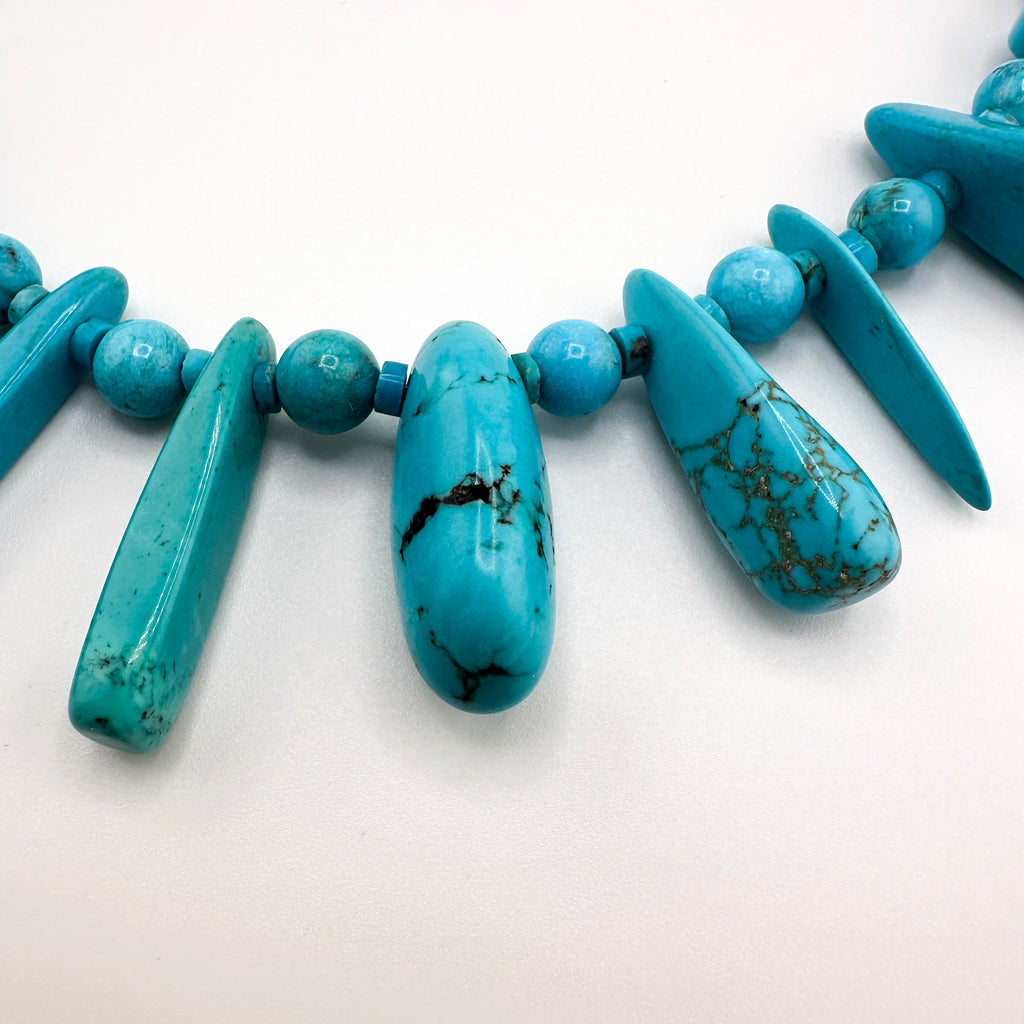 Turquoise and Sterling Silver Necklace close-up on white background